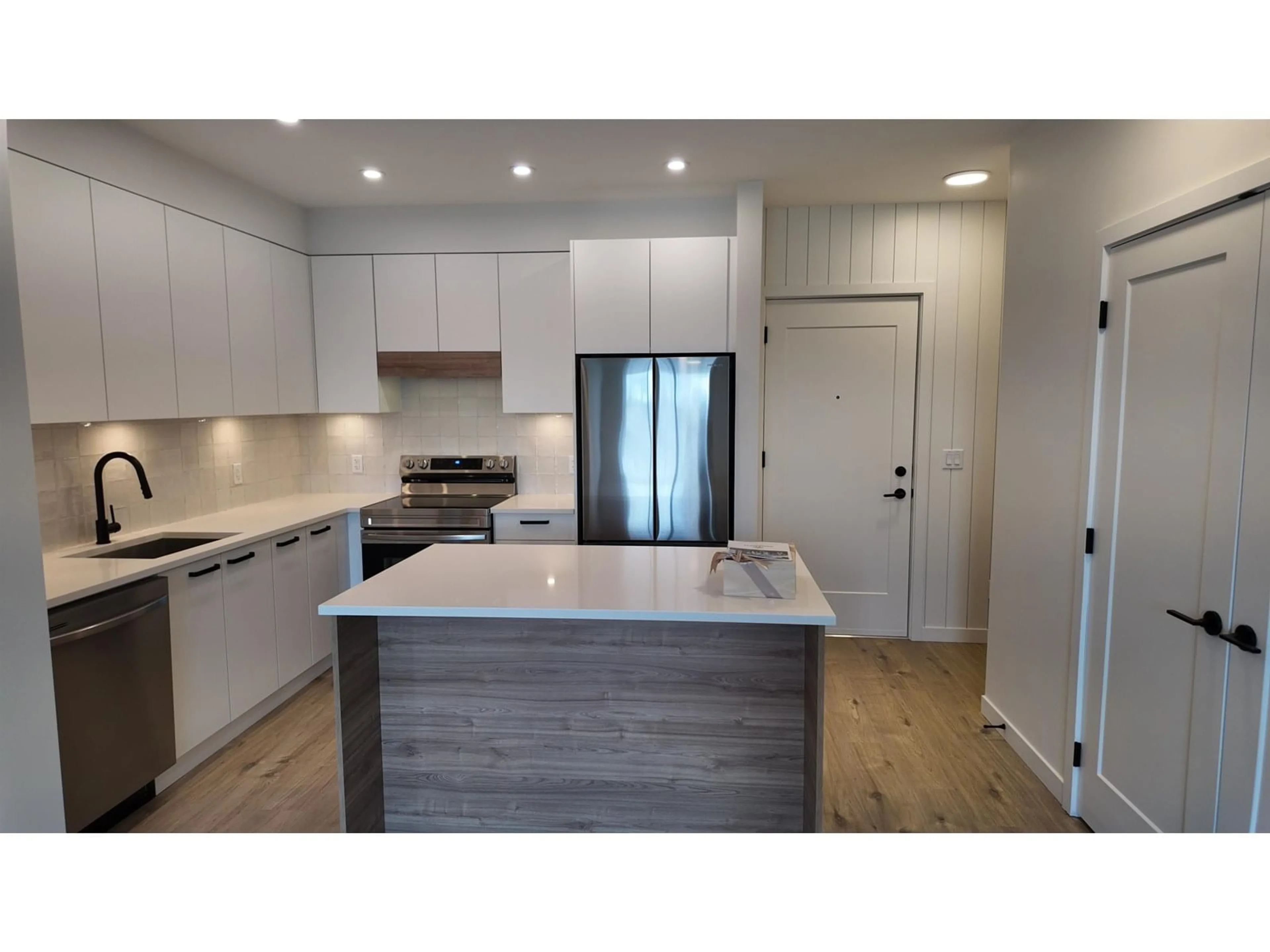 Open concept kitchen, wood/laminate floor for 304 - 33920 BEST, Mission British Columbia V2V7A4