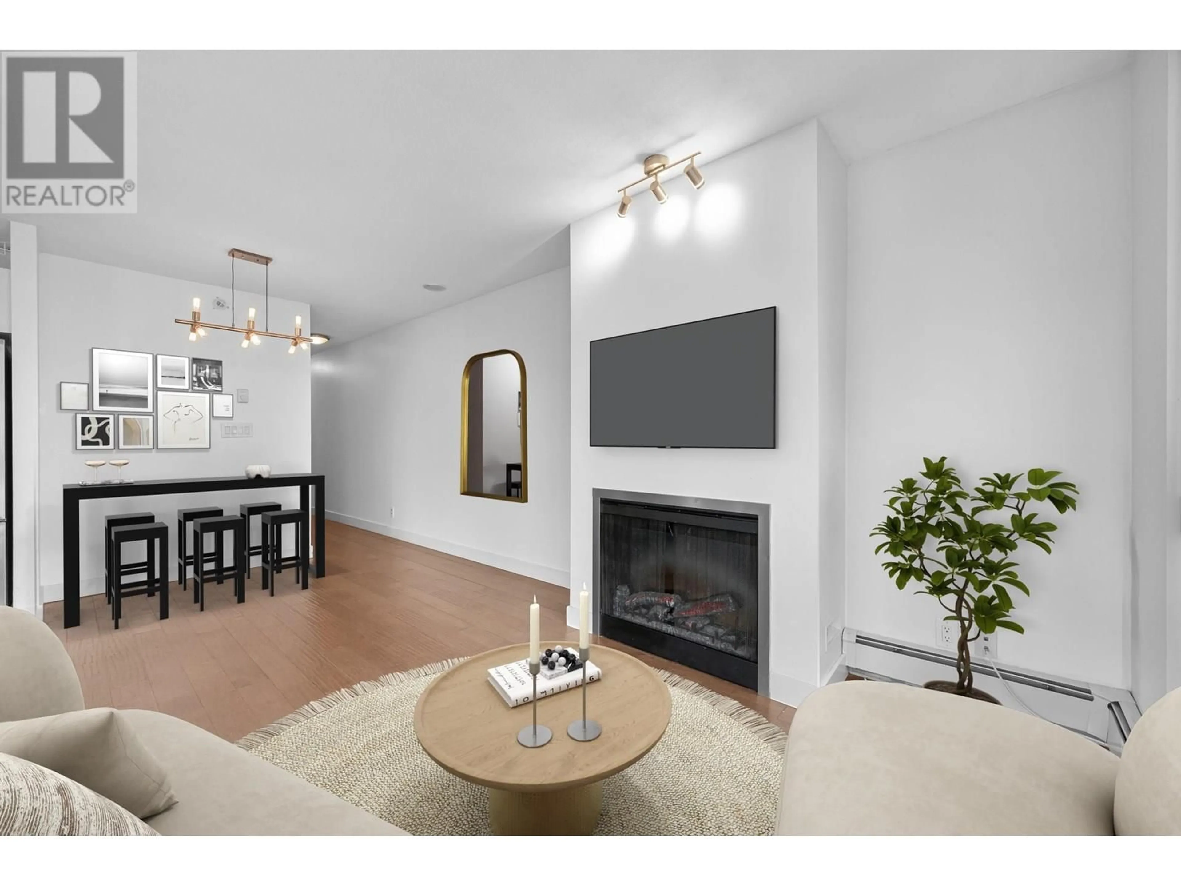 Living room with furniture, wood/laminate floor for 605 - 151 2ND STREET, North Vancouver British Columbia V7M3P1