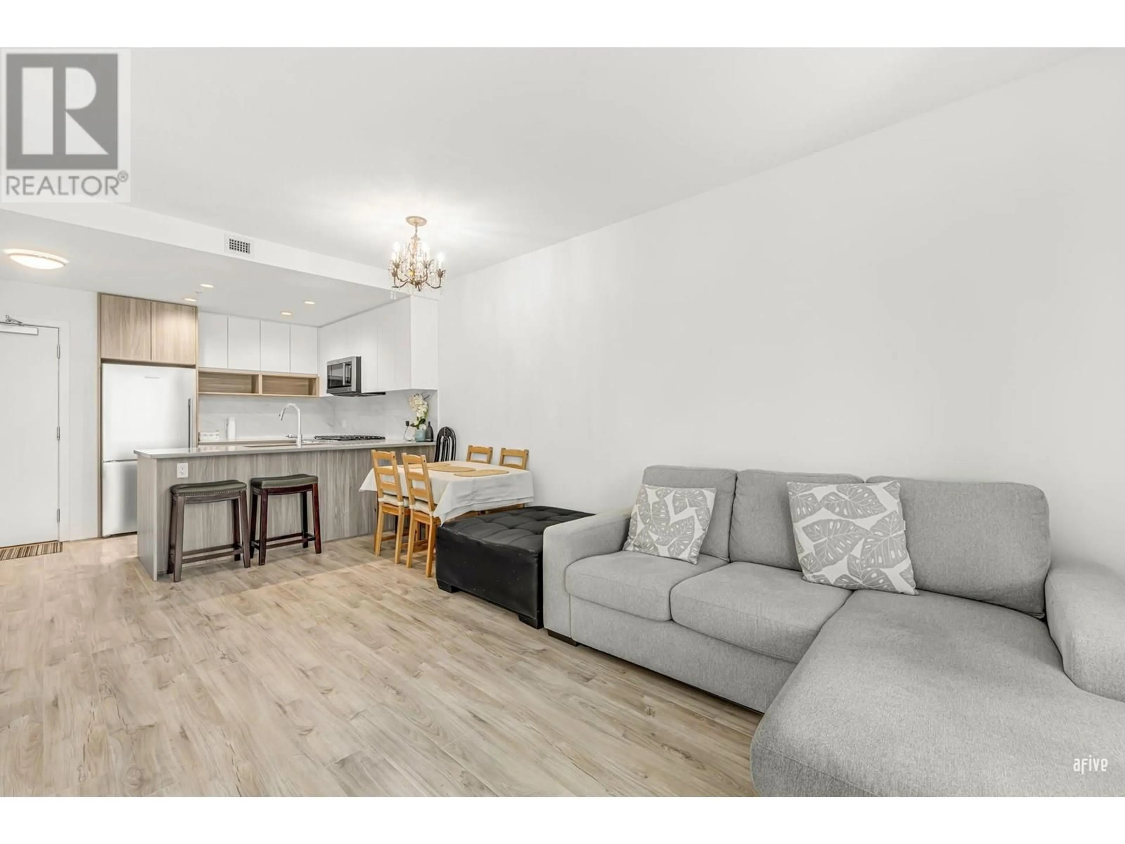 Living room with furniture, wood/laminate floor for 908 - 8940 UNIVERSITY CRESCENT, Burnaby British Columbia V5A4Y8