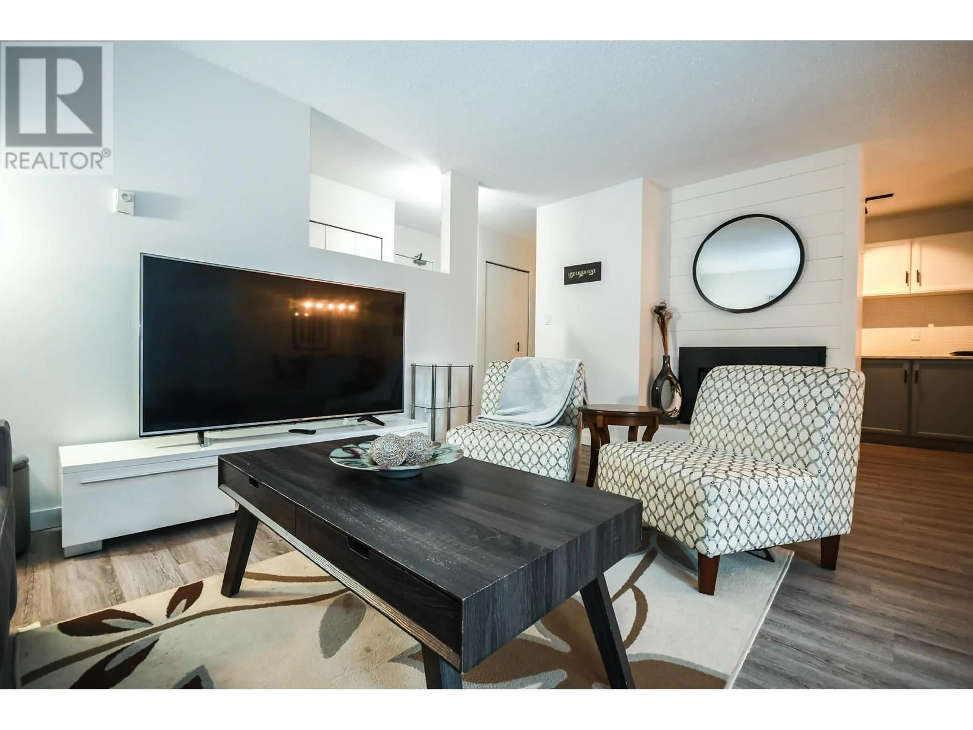 Living room with furniture, wood/laminate floor for 126 - 3033 OSPIKA BOULEVARD, Prince George British Columbia V2N4L5