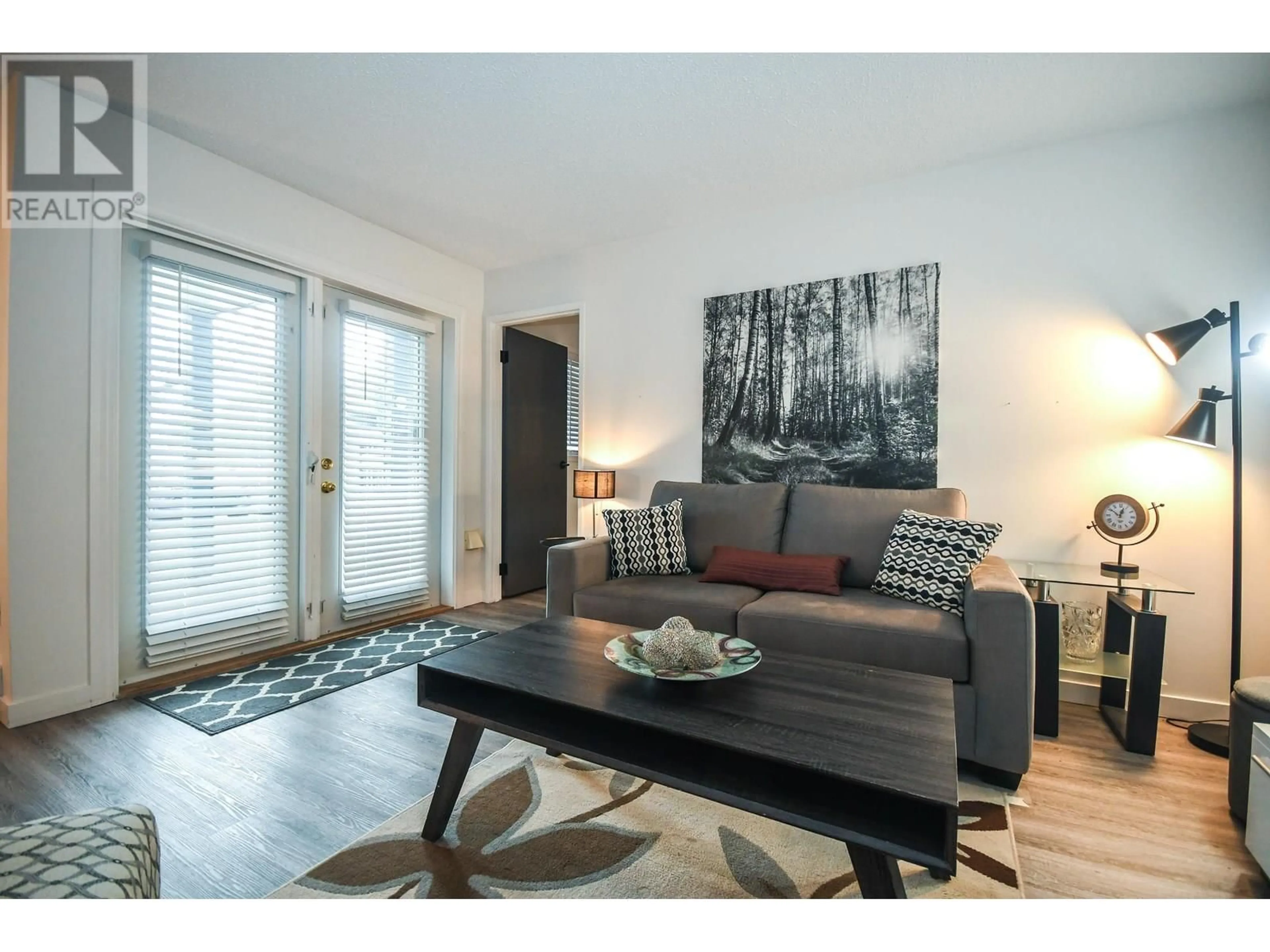Living room with furniture, wood/laminate floor for 126 - 3033 OSPIKA BOULEVARD, Prince George British Columbia V2N4L5