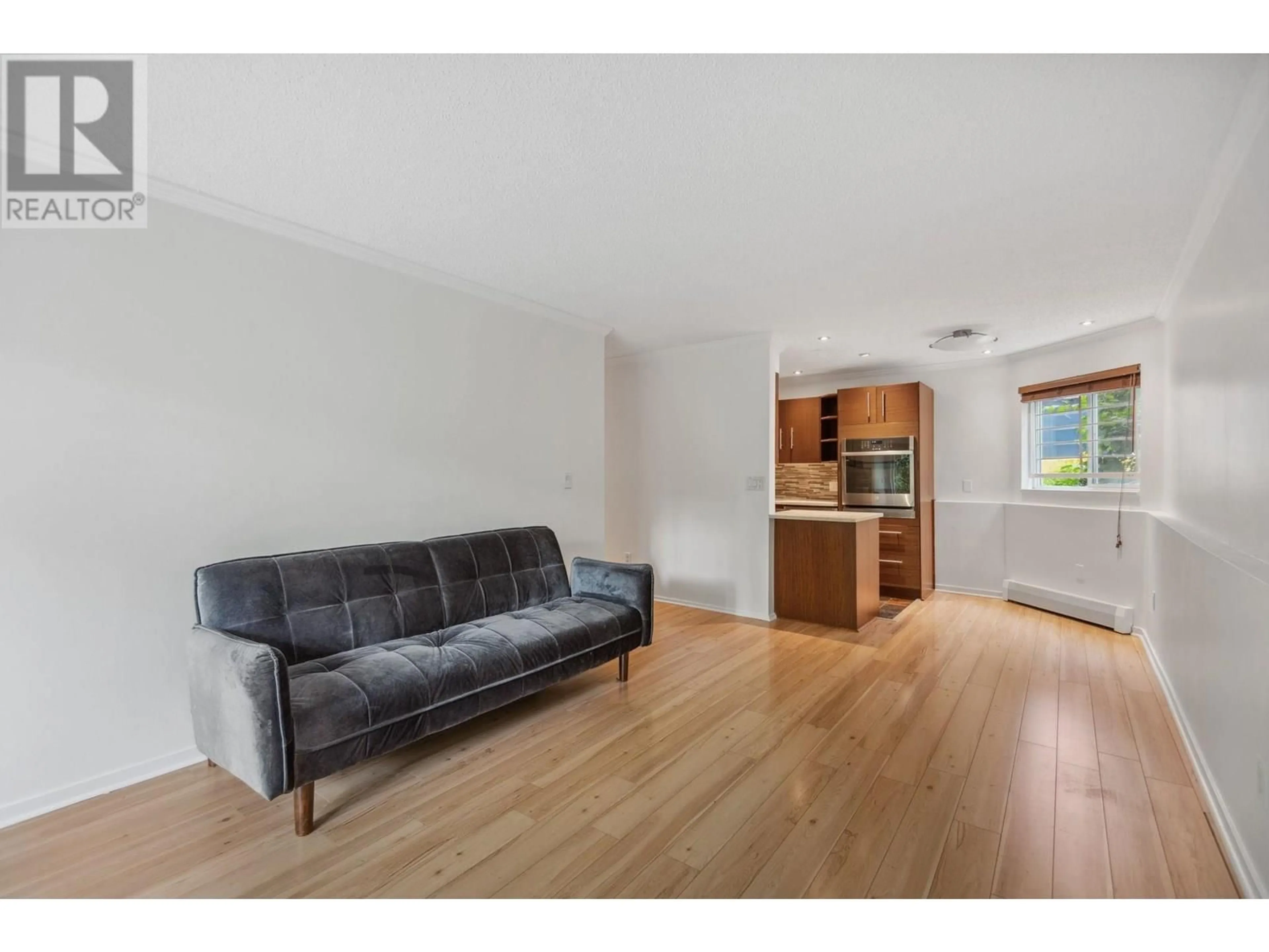 Living room with furniture, wood/laminate floor for 106 - 1169 NELSON STREET, Vancouver British Columbia V6E1J3