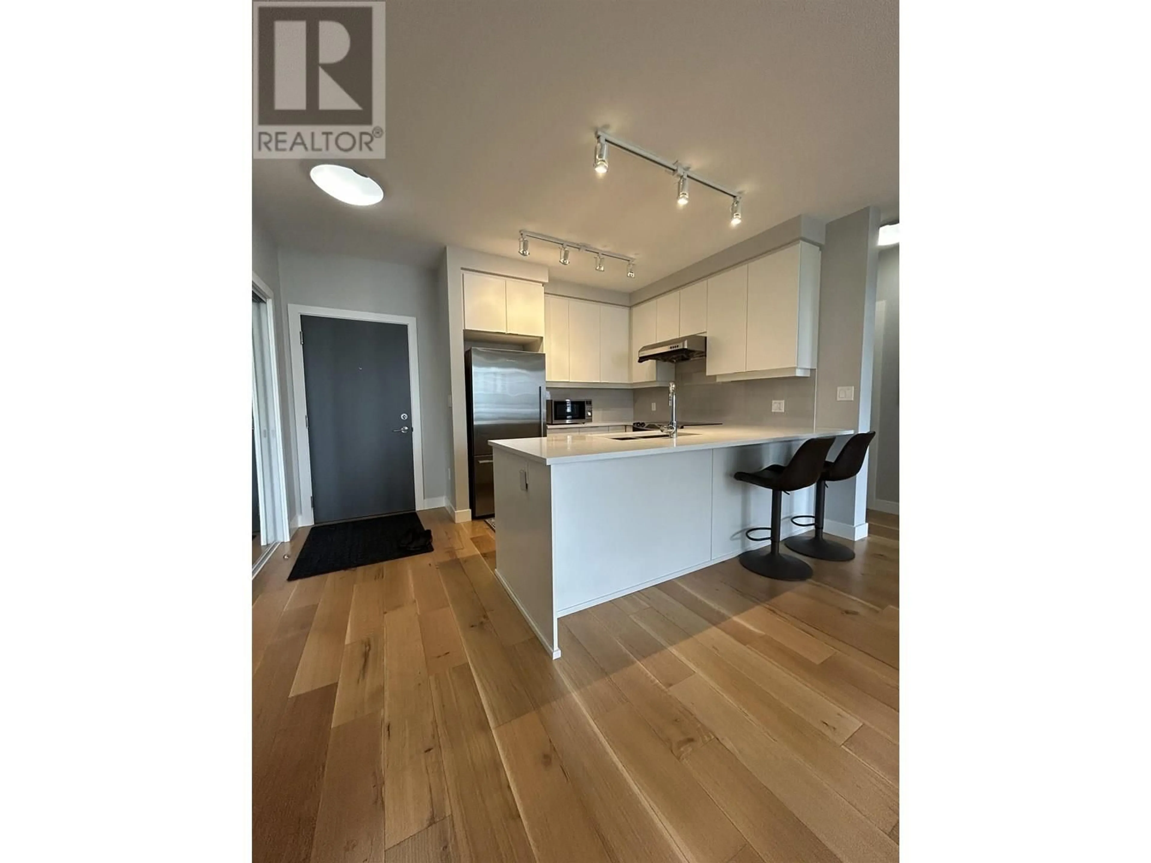 Open concept kitchen, wood/laminate floor for 518 - 9393 TOWER ROAD, Burnaby British Columbia V5A0E2