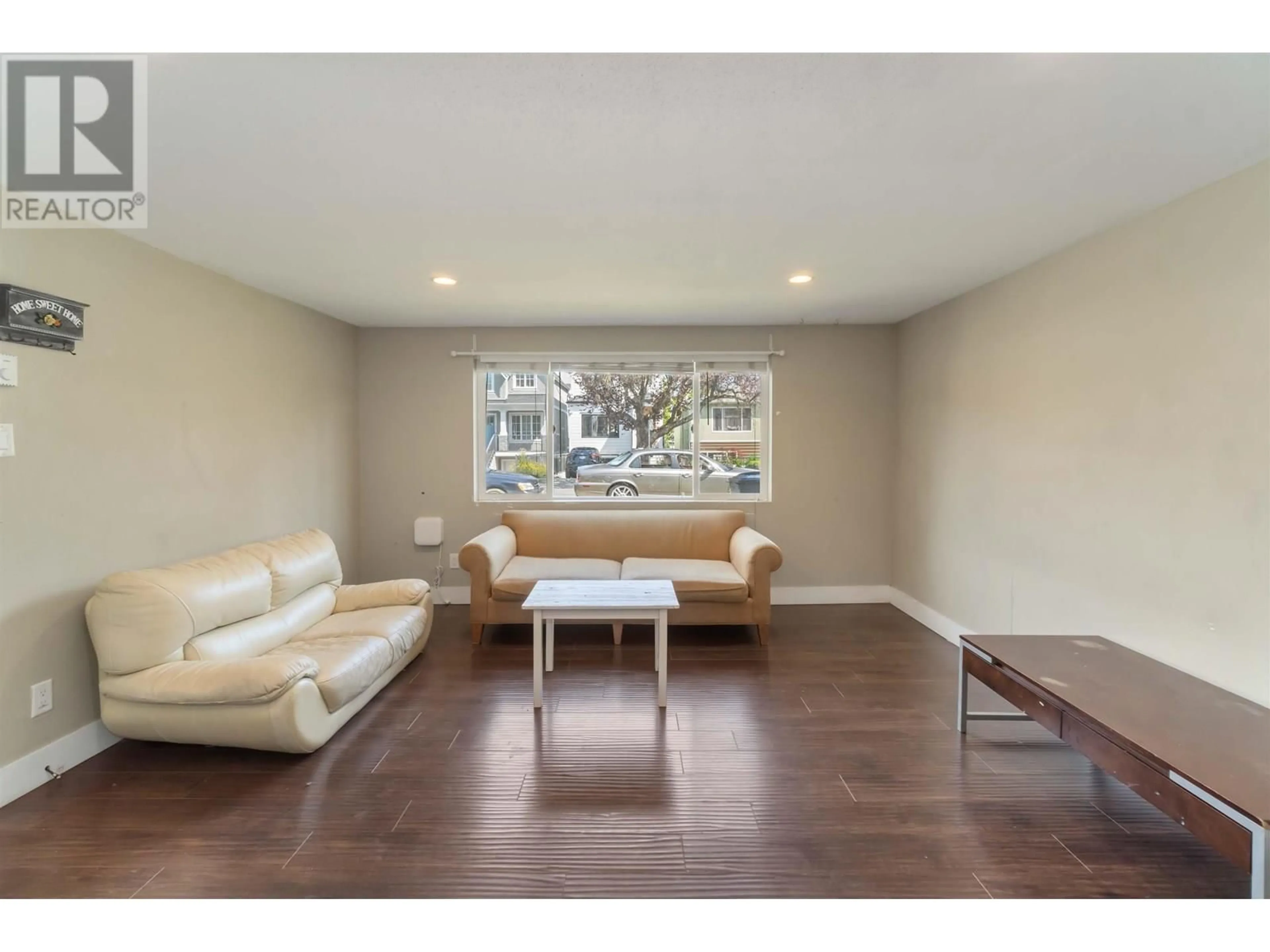 Living room with furniture, wood/laminate floor for 242 26TH AVENUE, Vancouver British Columbia V5V2H3