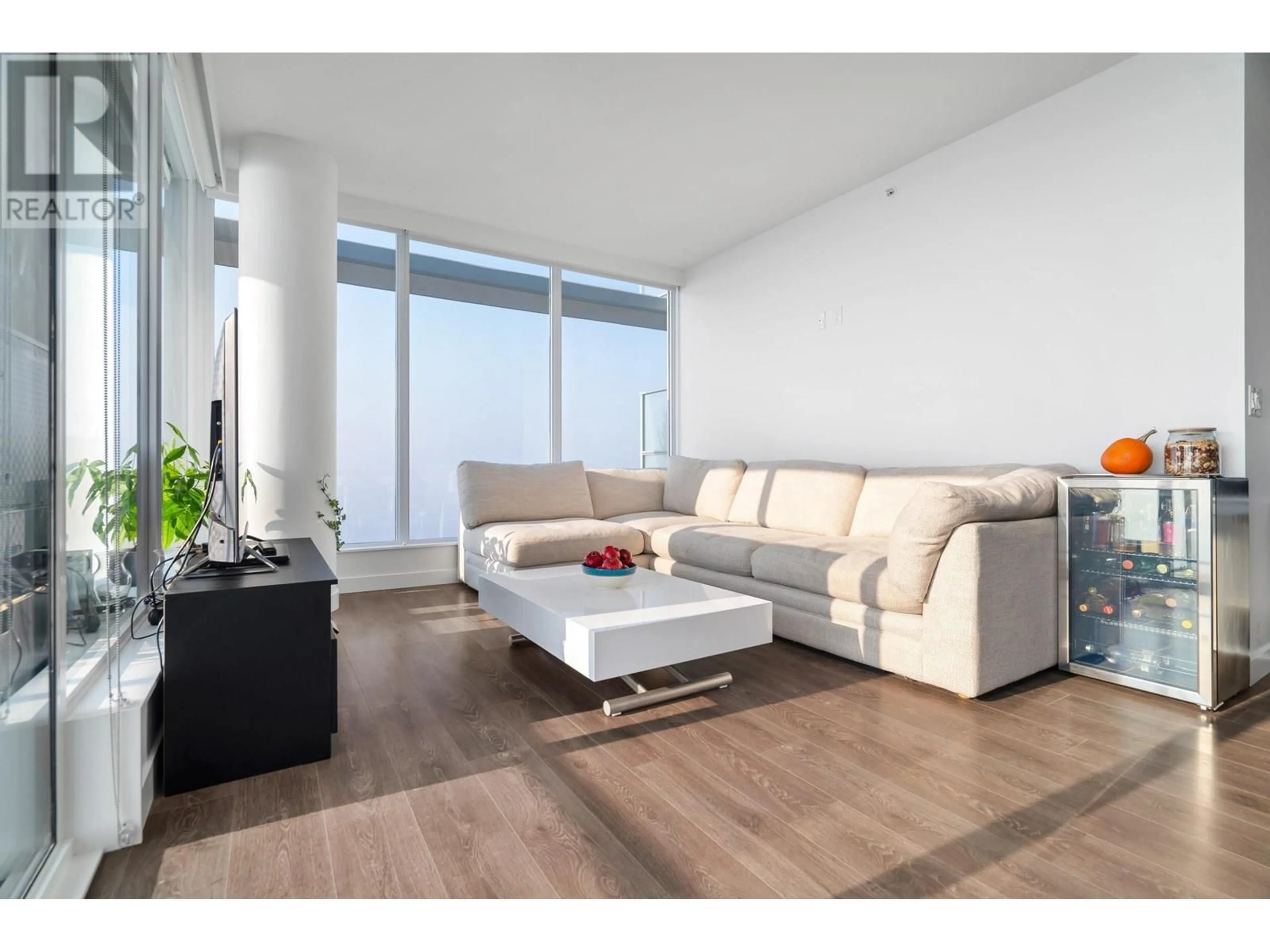 Living room with furniture, wood/laminate floor for 3806 - 567 CLARKE ROAD, Coquitlam British Columbia V3J0K7