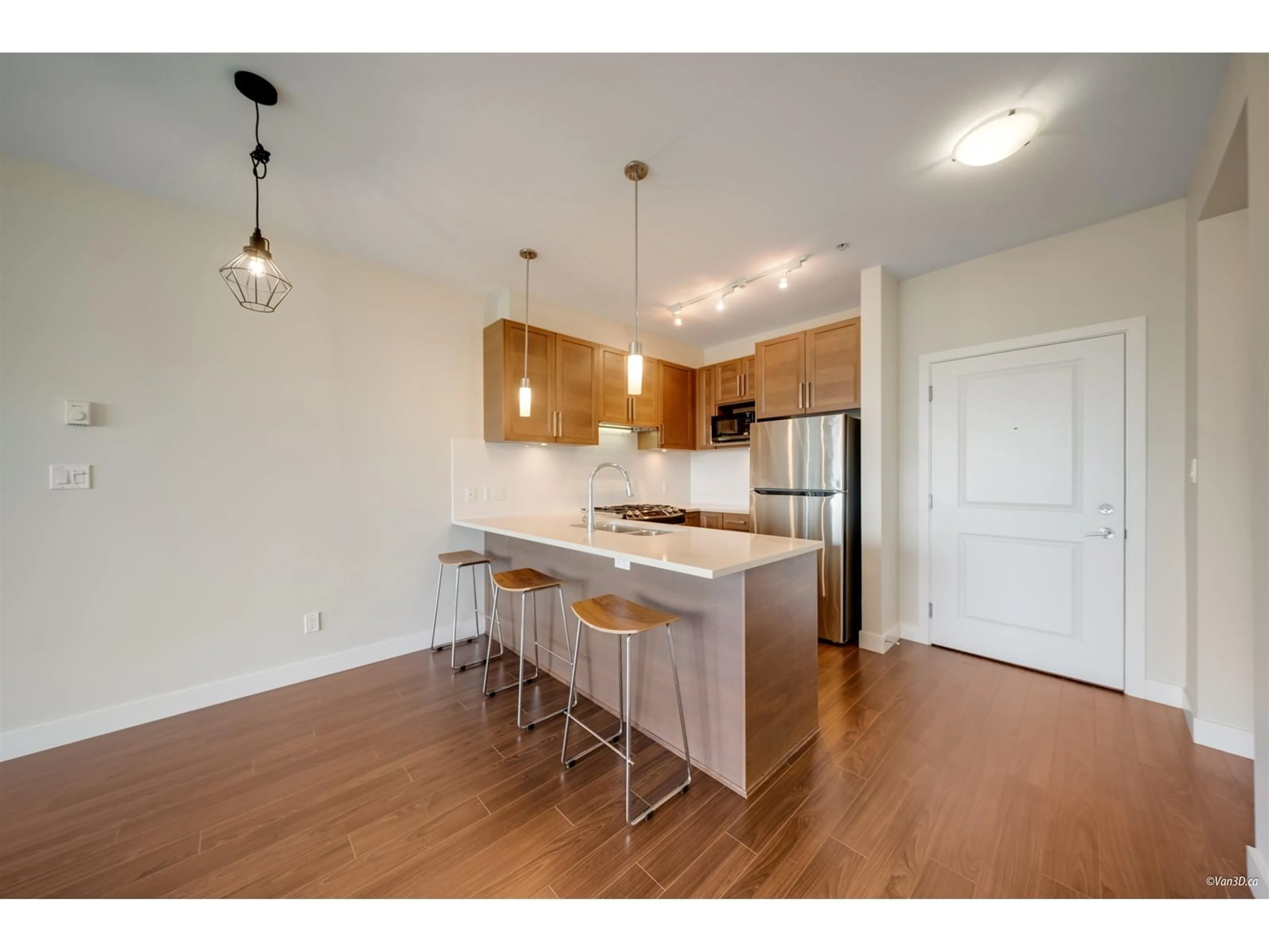 Open concept kitchen, wood/laminate floor for 210 - 15850 26, Surrey British Columbia V3S2N6