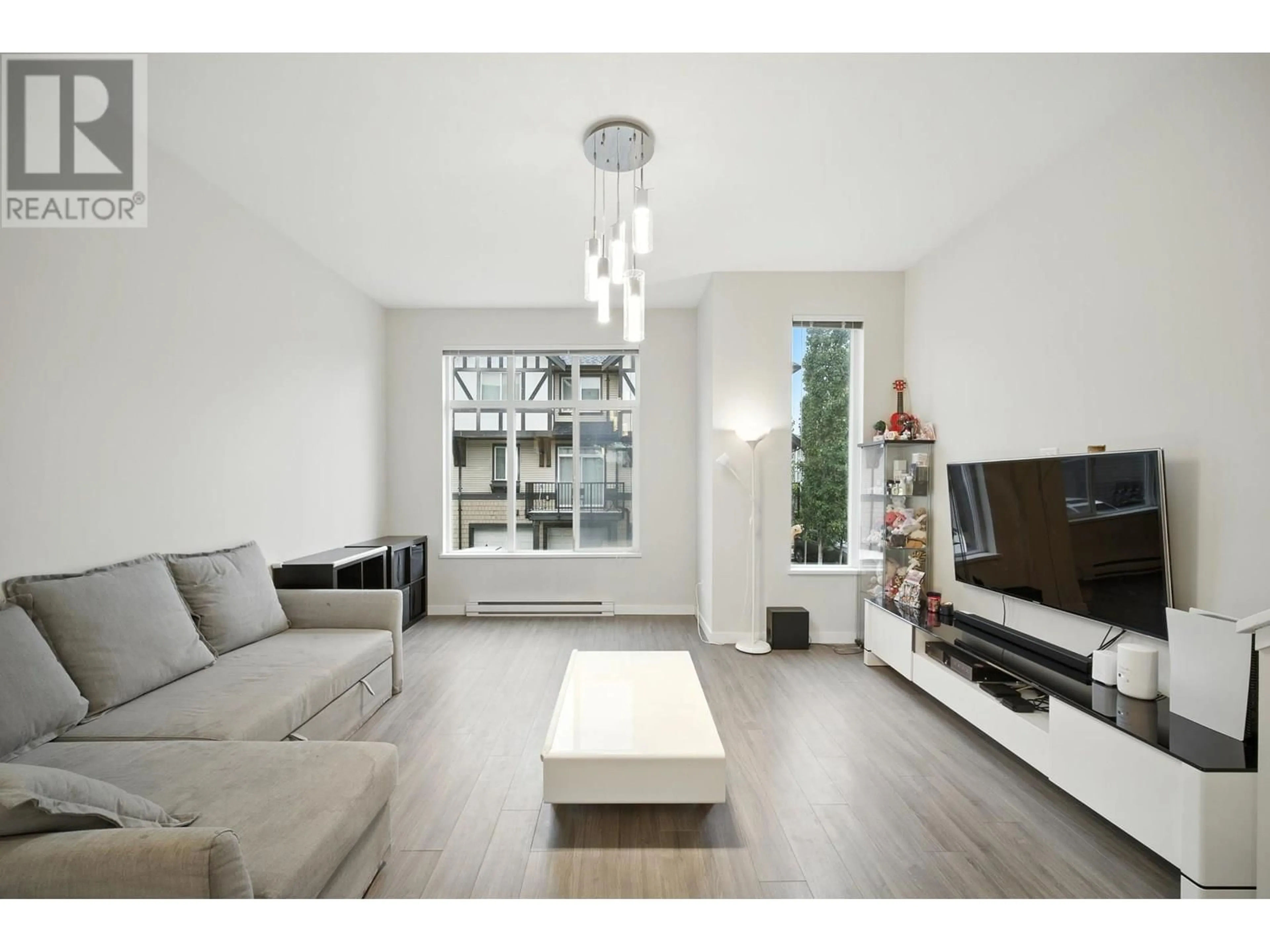 Living room with furniture, wood/laminate floor for 59 - 9728 ALEXANDRA ROAD, Richmond British Columbia V6X0M4