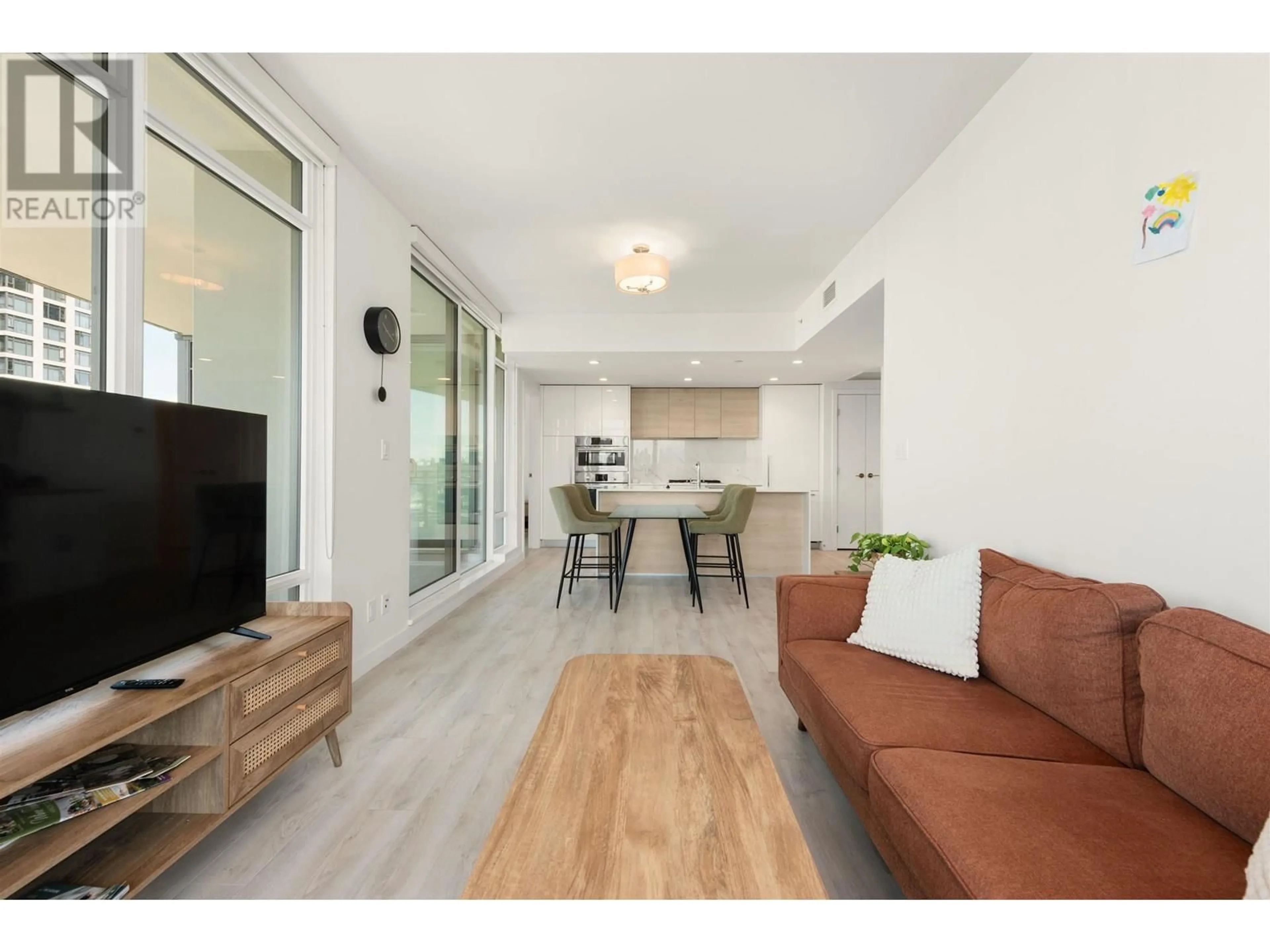 Living room with furniture, wood/laminate floor for 1808 - 2085 SKYLINE COURT, Burnaby British Columbia V5C0M6