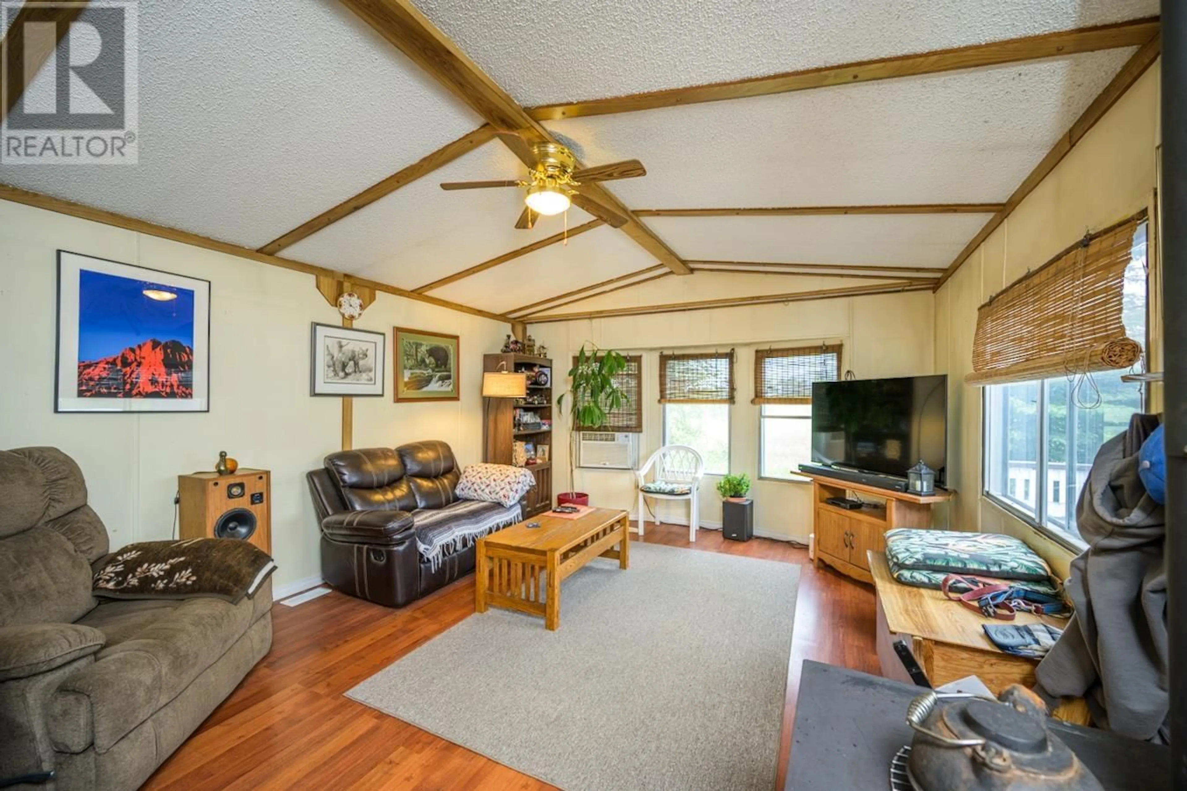 Living room with furniture, wood/laminate floor for 10800 SALMON VALLEY ROAD, Prince George British Columbia V2K5T4