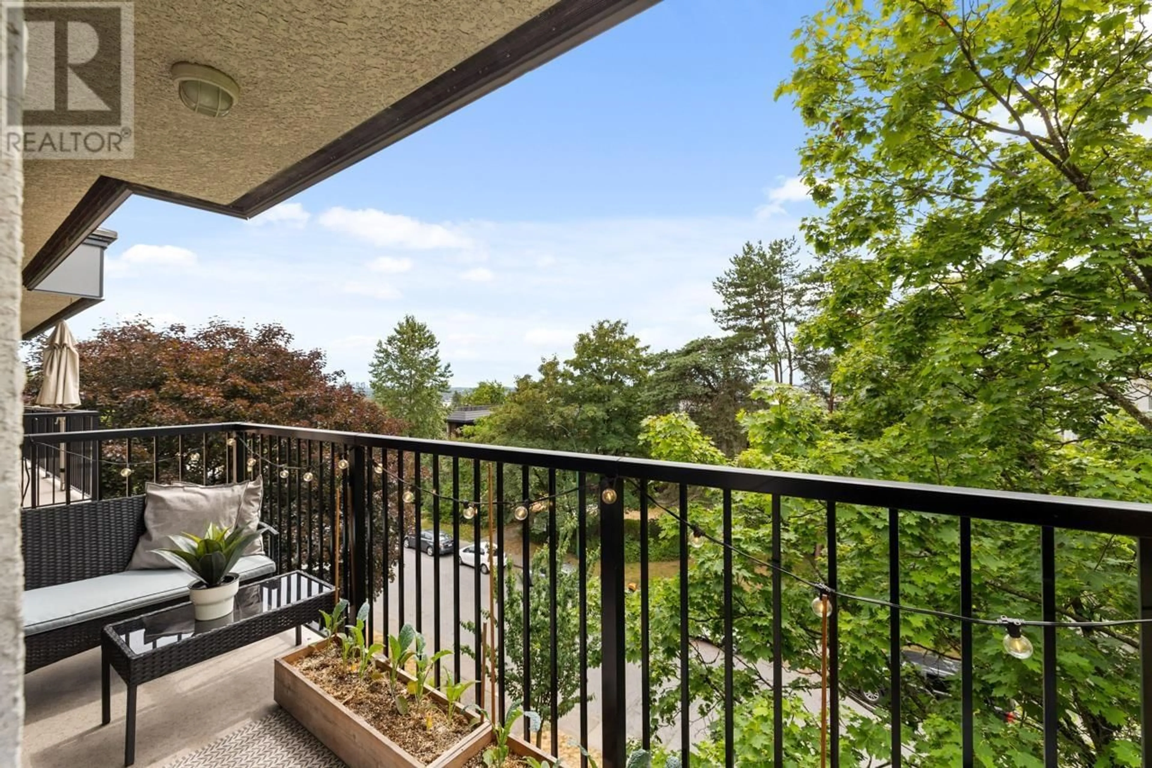 Balcony in the apartment, forest/trees view for 303 - 120 5TH STREET, North Vancouver British Columbia V7L1L5