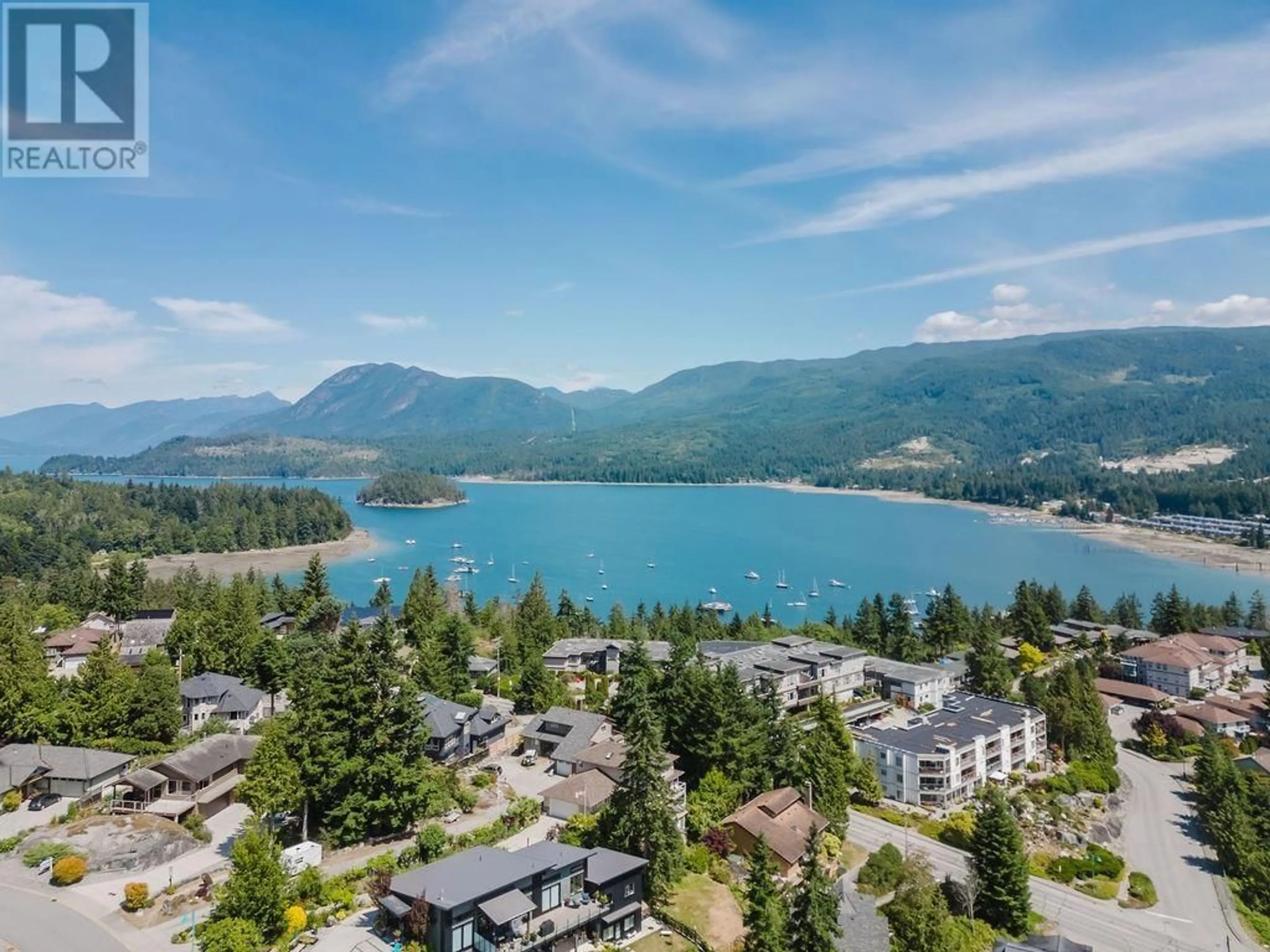 A pic from outside/outdoor area/front of a property/back of a property/a pic from drone, water/lake/river/ocean view for 302 - 5780 TRAIL AVENUE, Sechelt British Columbia V0N3A6