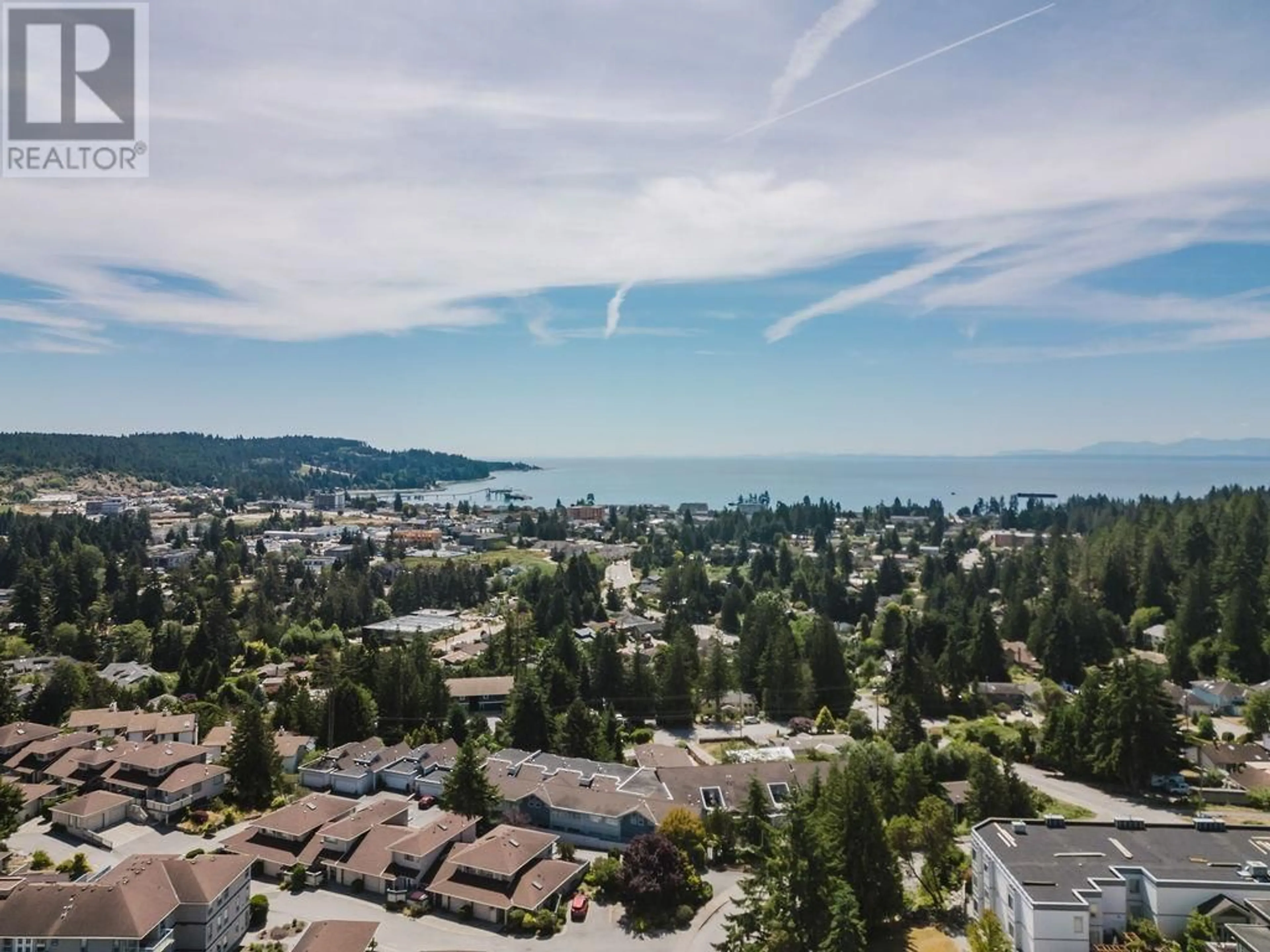 A pic from outside/outdoor area/front of a property/back of a property/a pic from drone, water/lake/river/ocean view for 302 - 5780 TRAIL AVENUE, Sechelt British Columbia V0N3A6
