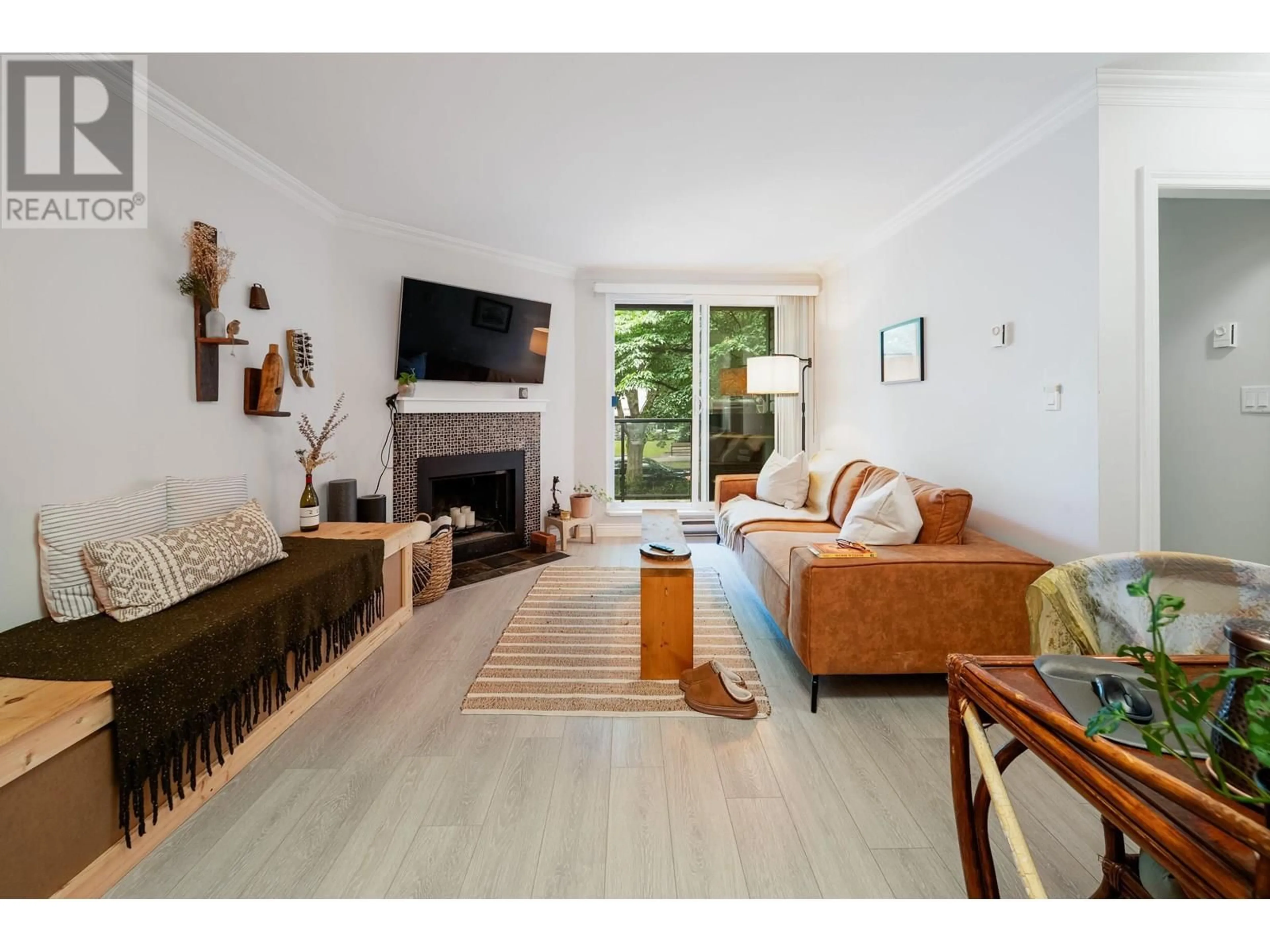 Living room with furniture, wood/laminate floor for 209 - 1550 BARCLAY STREET, Vancouver British Columbia V6G3B1