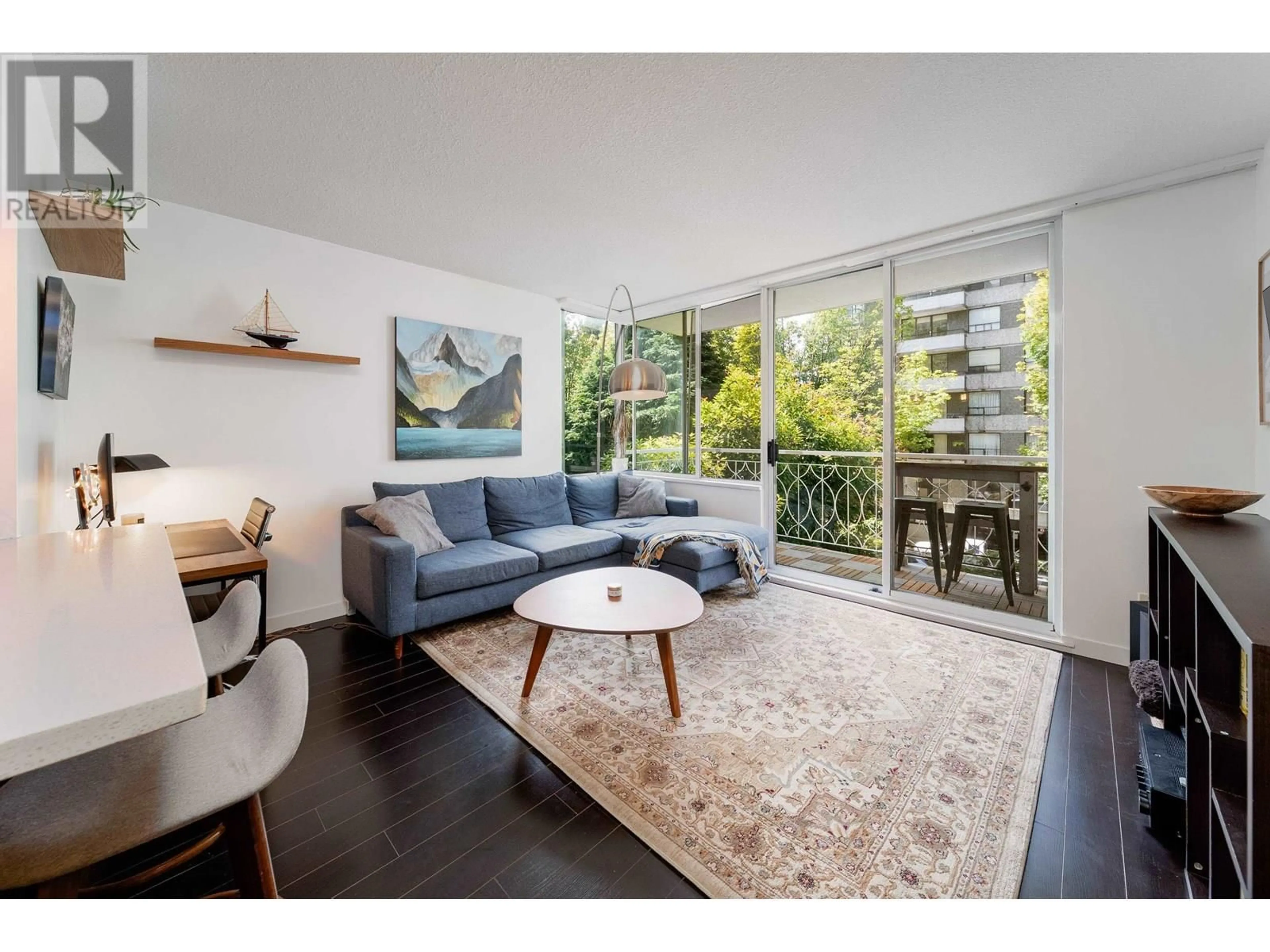 Living room with furniture, wood/laminate floor for 201 - 1219 HARWOOD STREET, Vancouver British Columbia V6E1S5