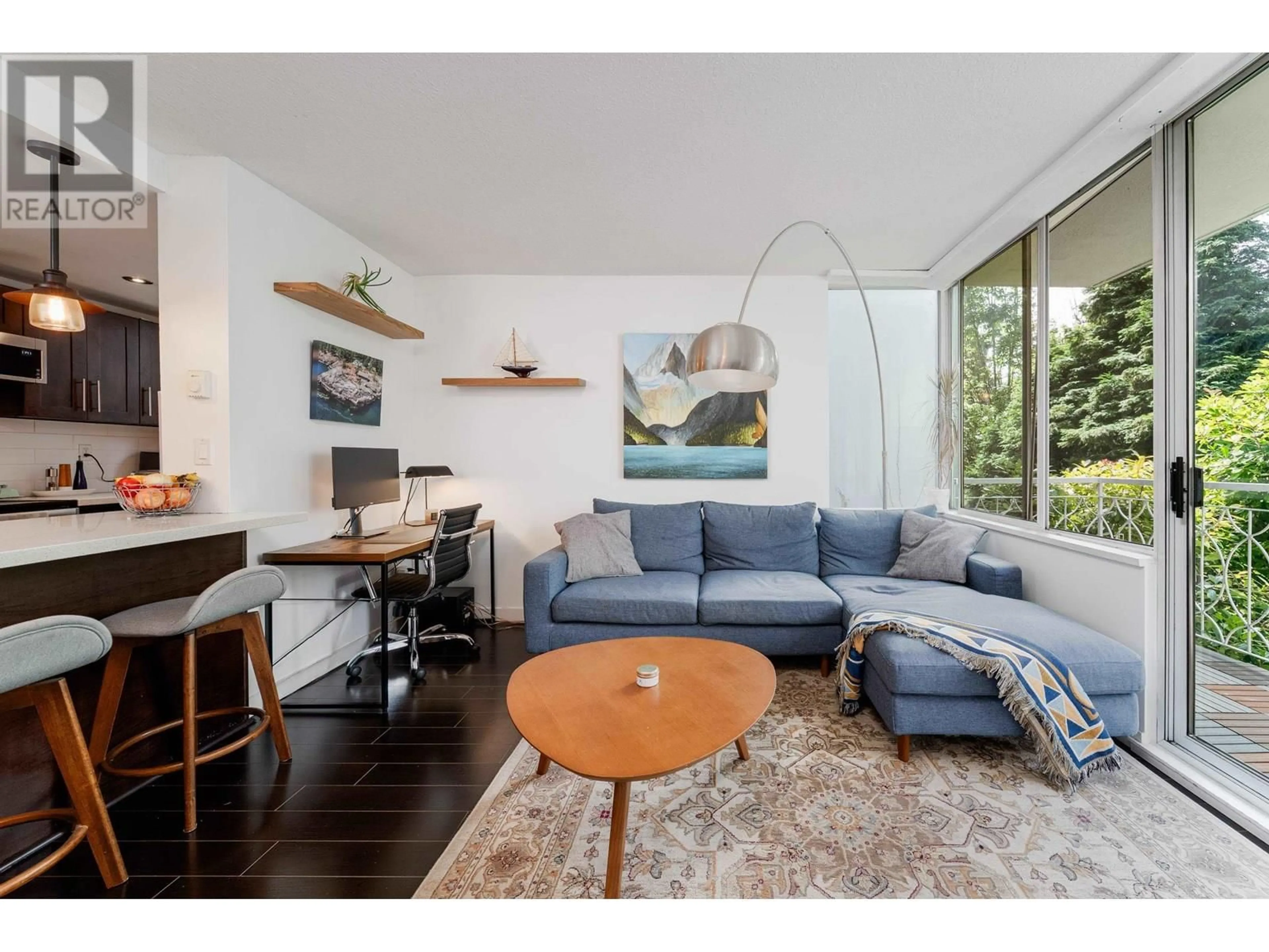 Living room with furniture, wood/laminate floor for 201 - 1219 HARWOOD STREET, Vancouver British Columbia V6E1S5
