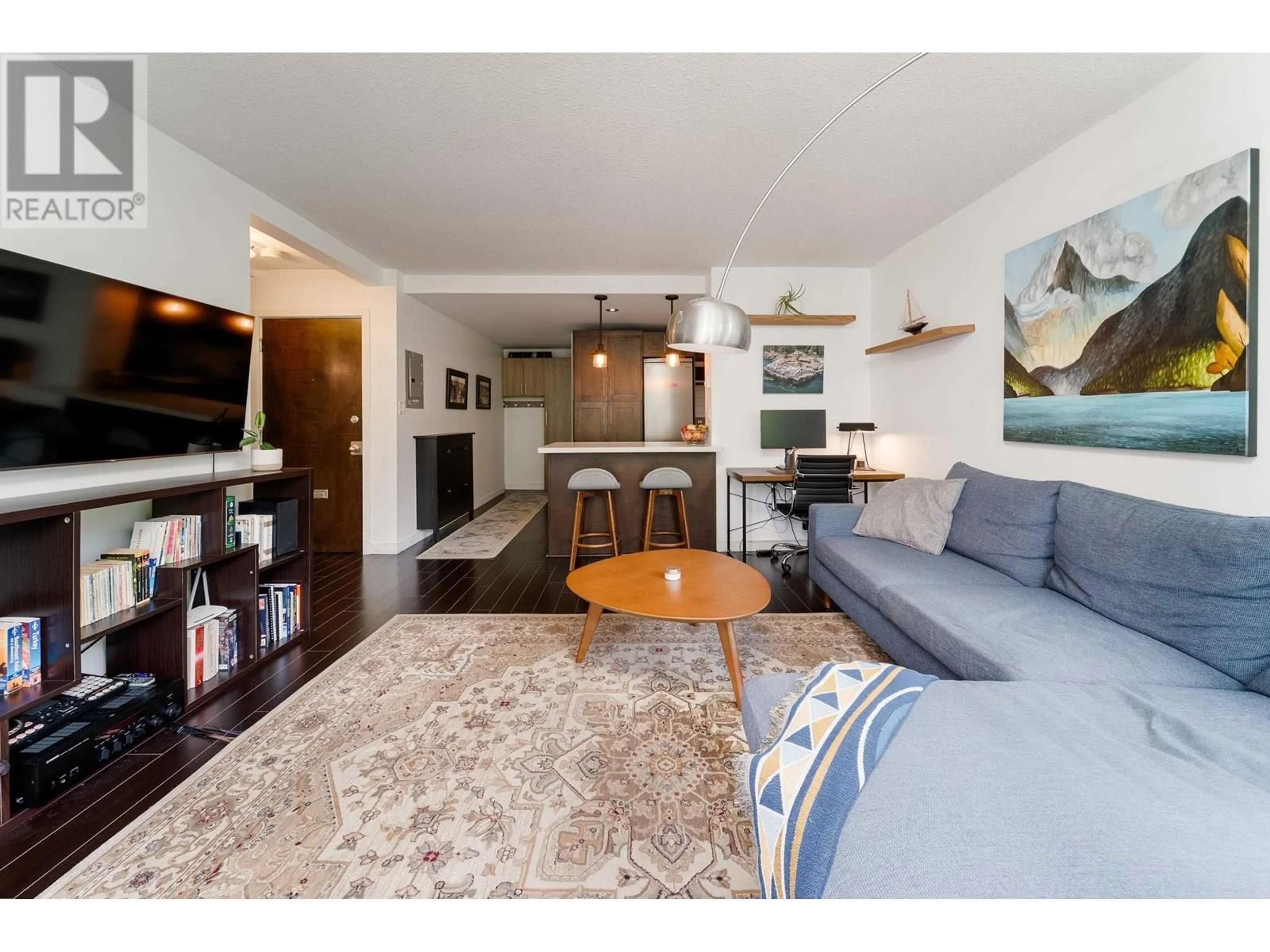 Living room with furniture, wood/laminate floor for 201 - 1219 HARWOOD STREET, Vancouver British Columbia V6E1S5