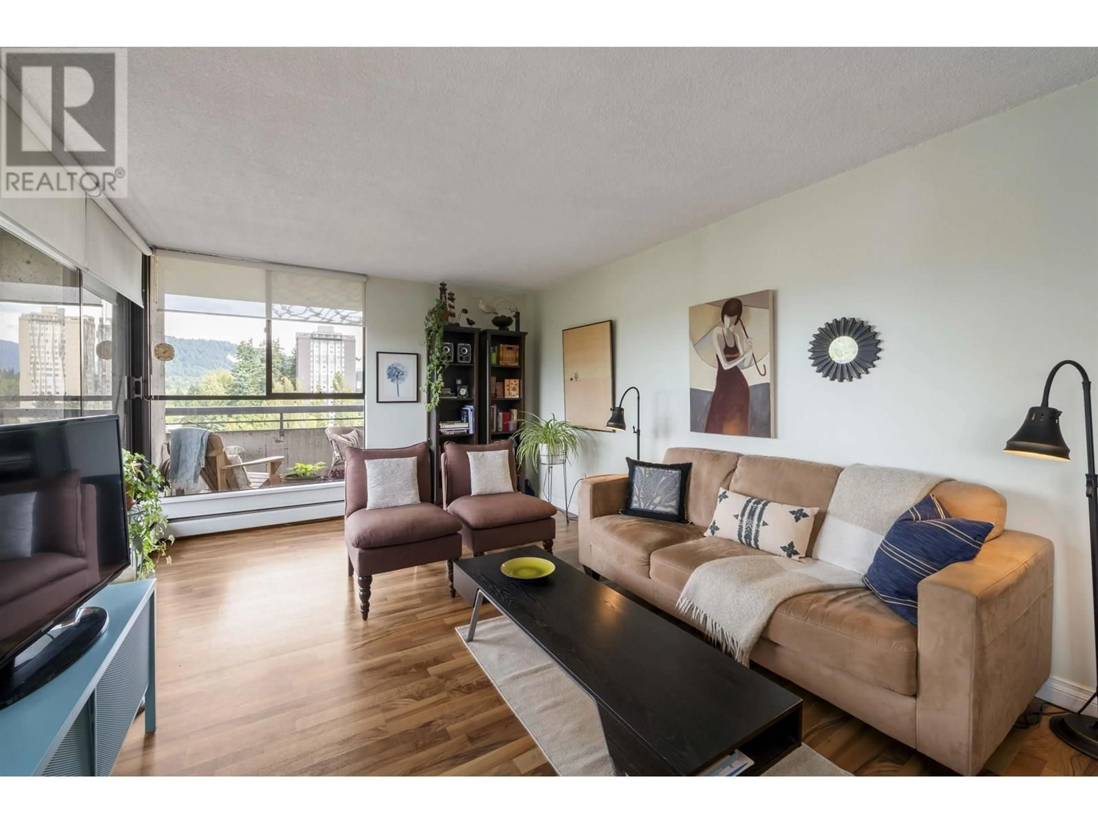 Living room with furniture, wood/laminate floor for 1105 - 3737 BARTLETT COURT, Burnaby British Columbia V3J7E3
