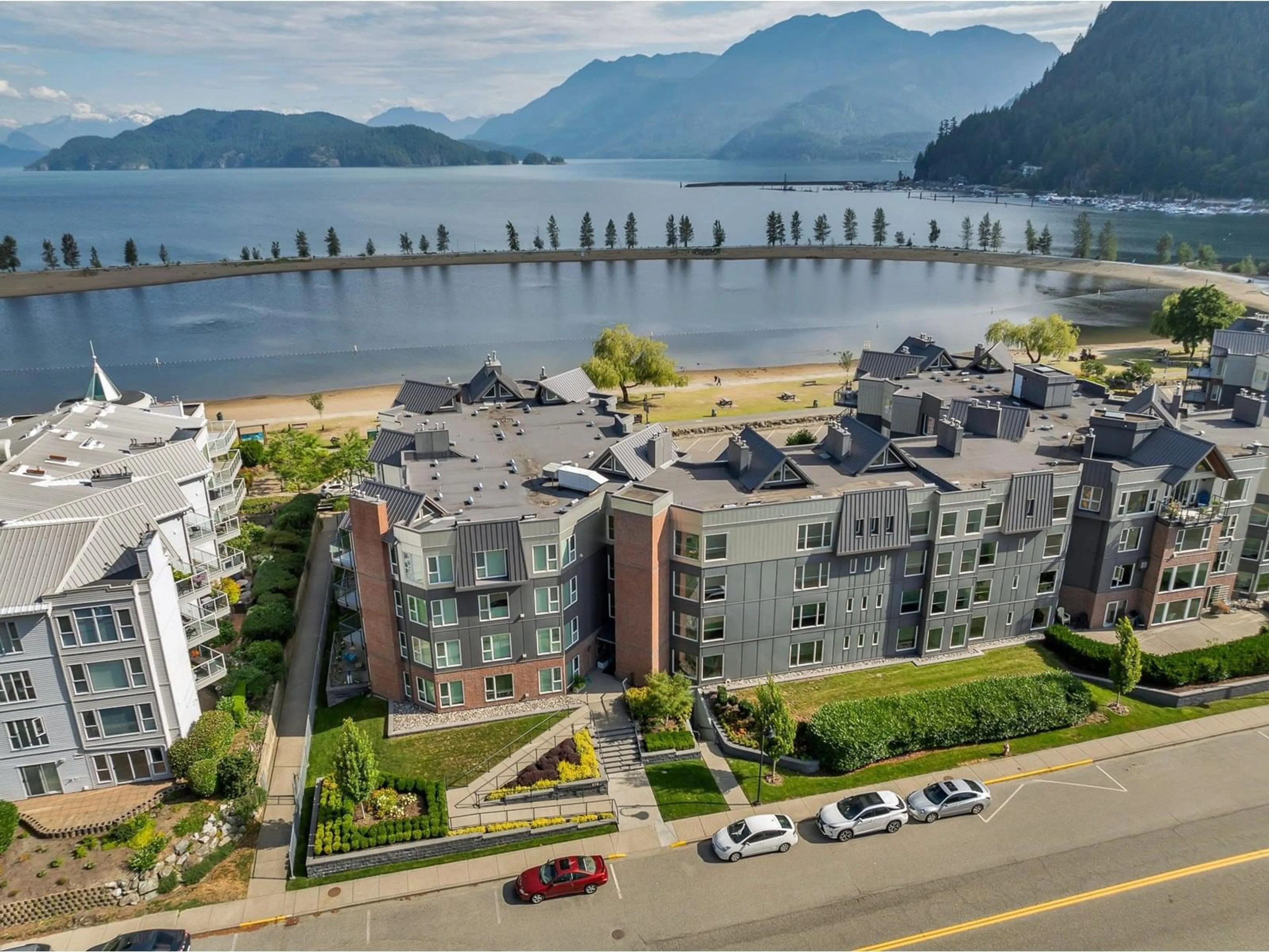 A pic from outside/outdoor area/front of a property/back of a property/a pic from drone, water/lake/river/ocean view for 109 - 378 ESPLANADE AVENUE, Harrison Hot Springs British Columbia V0M1A3