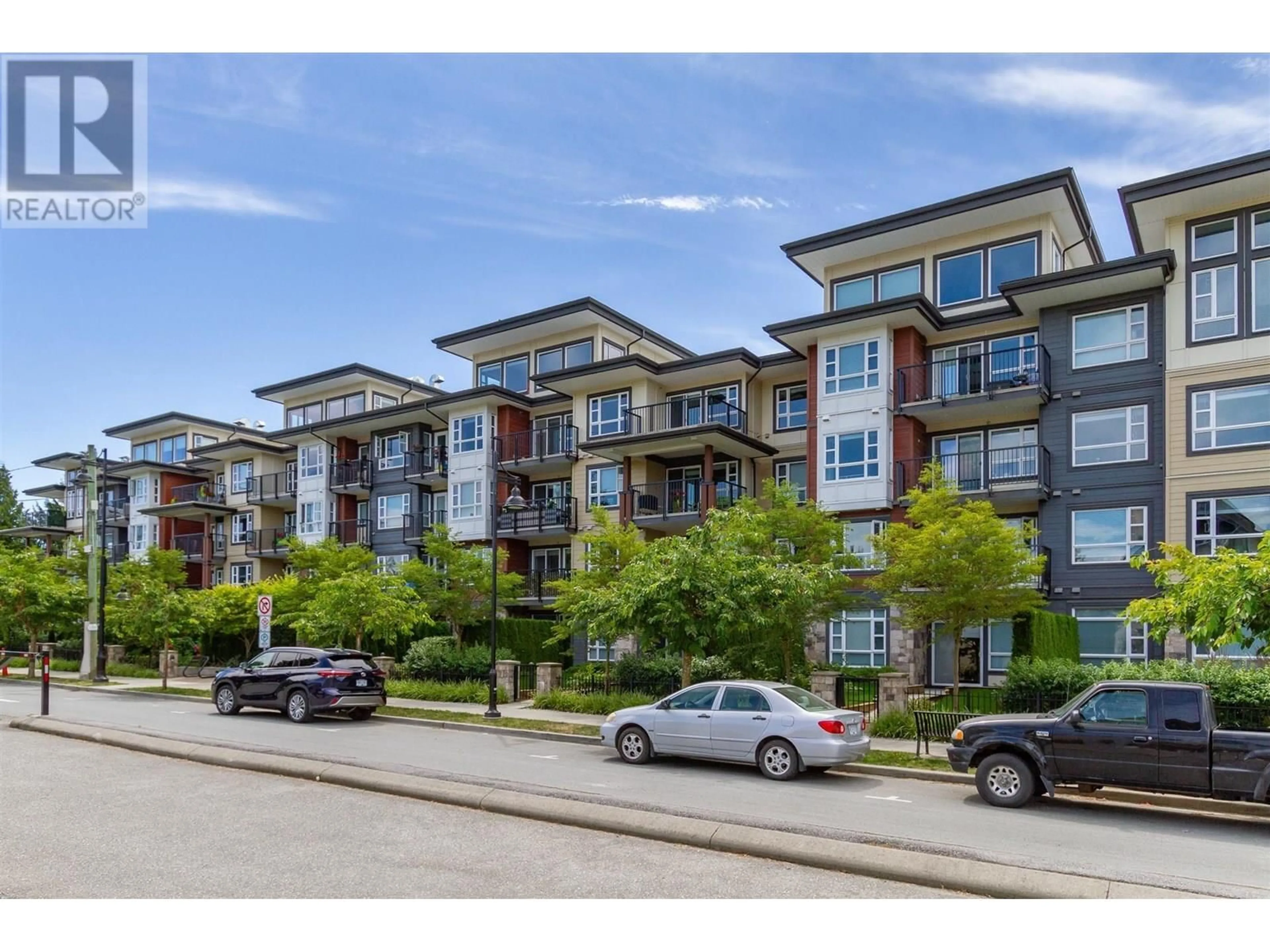 A pic from outside/outdoor area/front of a property/back of a property/a pic from drone, street for 409 - 22562 121 AVENUE, Maple Ridge British Columbia V2X3Y8