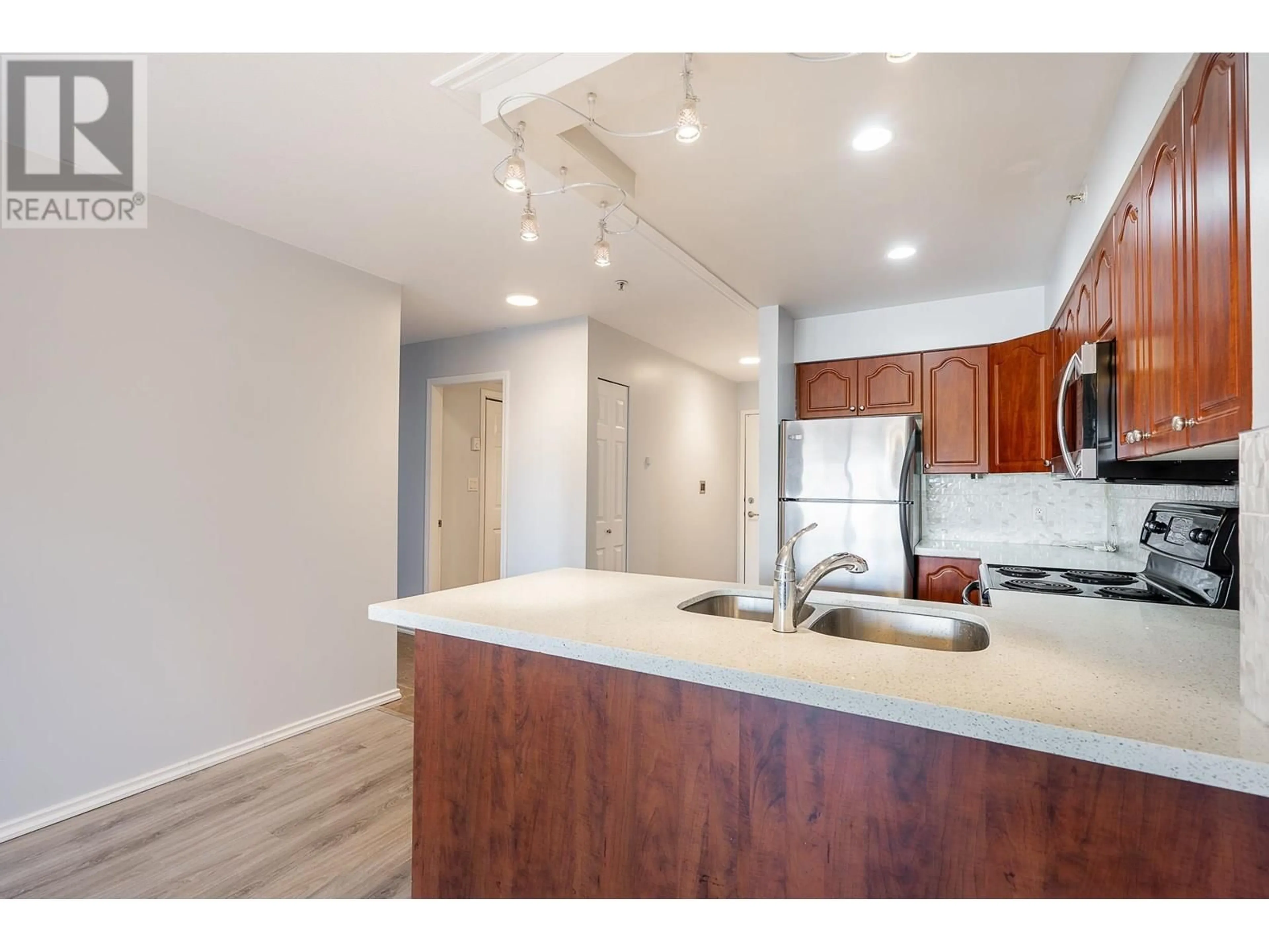 Open concept kitchen, wood/laminate floor for 208 - 633 16TH AVENUE, Vancouver British Columbia V5Z1S5