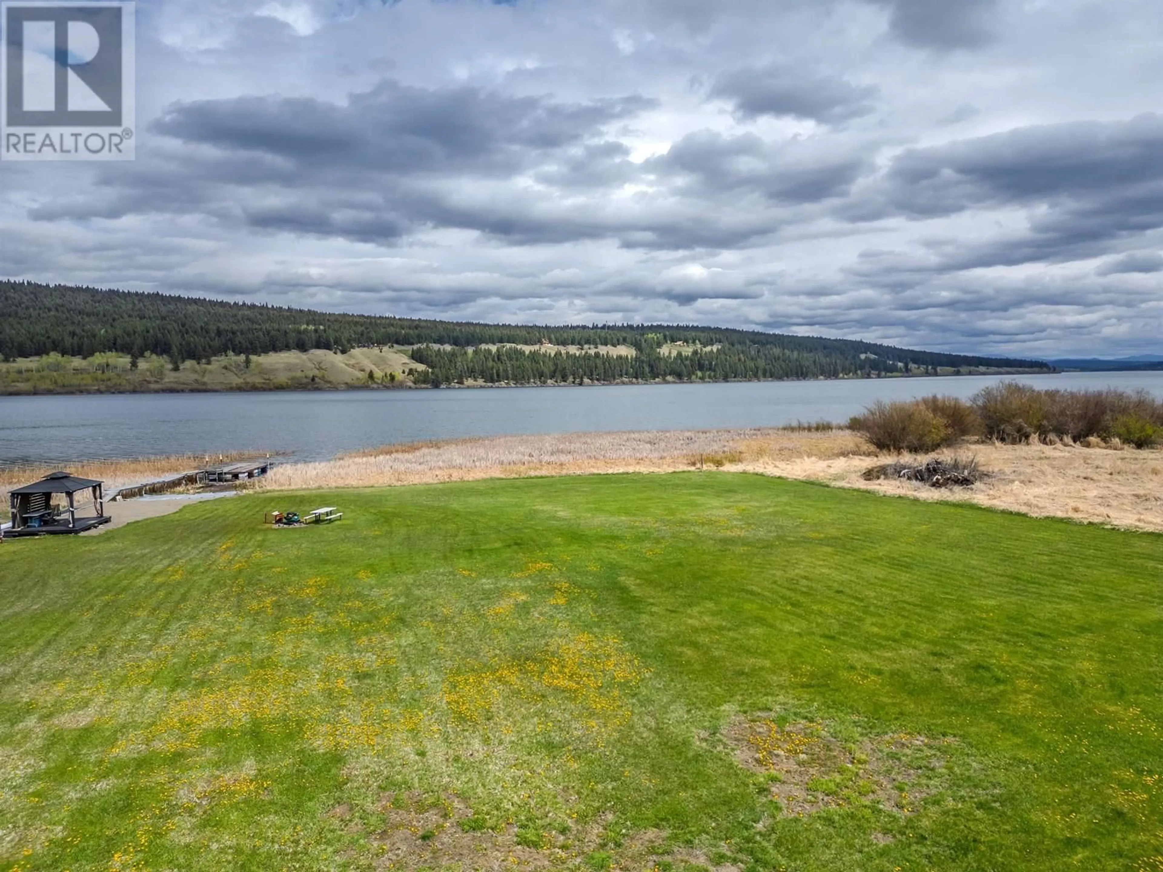 A pic from outside/outdoor area/front of a property/back of a property/a pic from drone, water/lake/river/ocean view for 6199 HUNT ROAD, 100 Mile House British Columbia V0K2E3