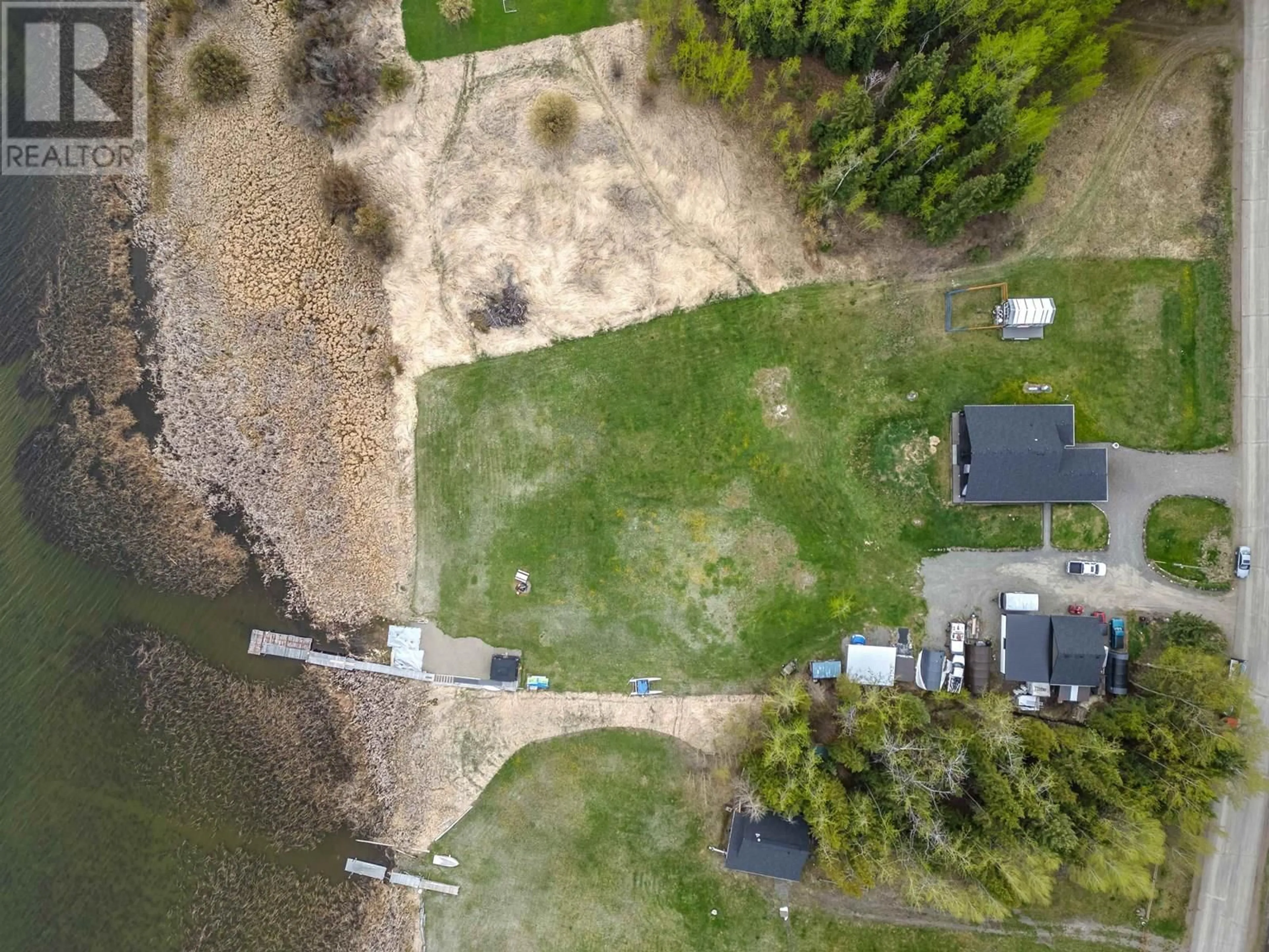 A pic from outside/outdoor area/front of a property/back of a property/a pic from drone, water/lake/river/ocean view for 6199 HUNT ROAD, 100 Mile House British Columbia V0K2E3