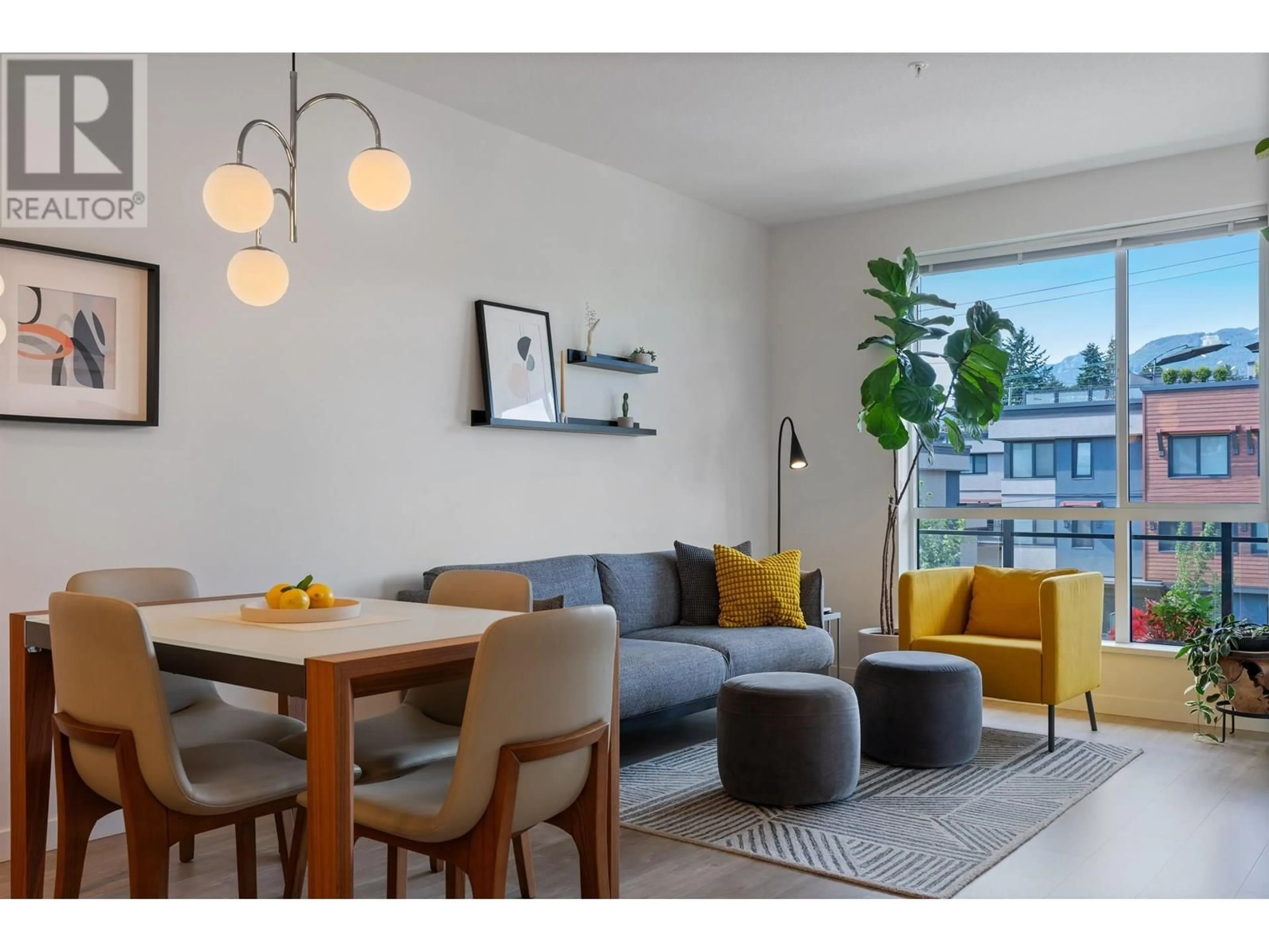 Living room with furniture, wood/laminate floor for 307 - 625 3RD STREET, North Vancouver British Columbia V7L1G6