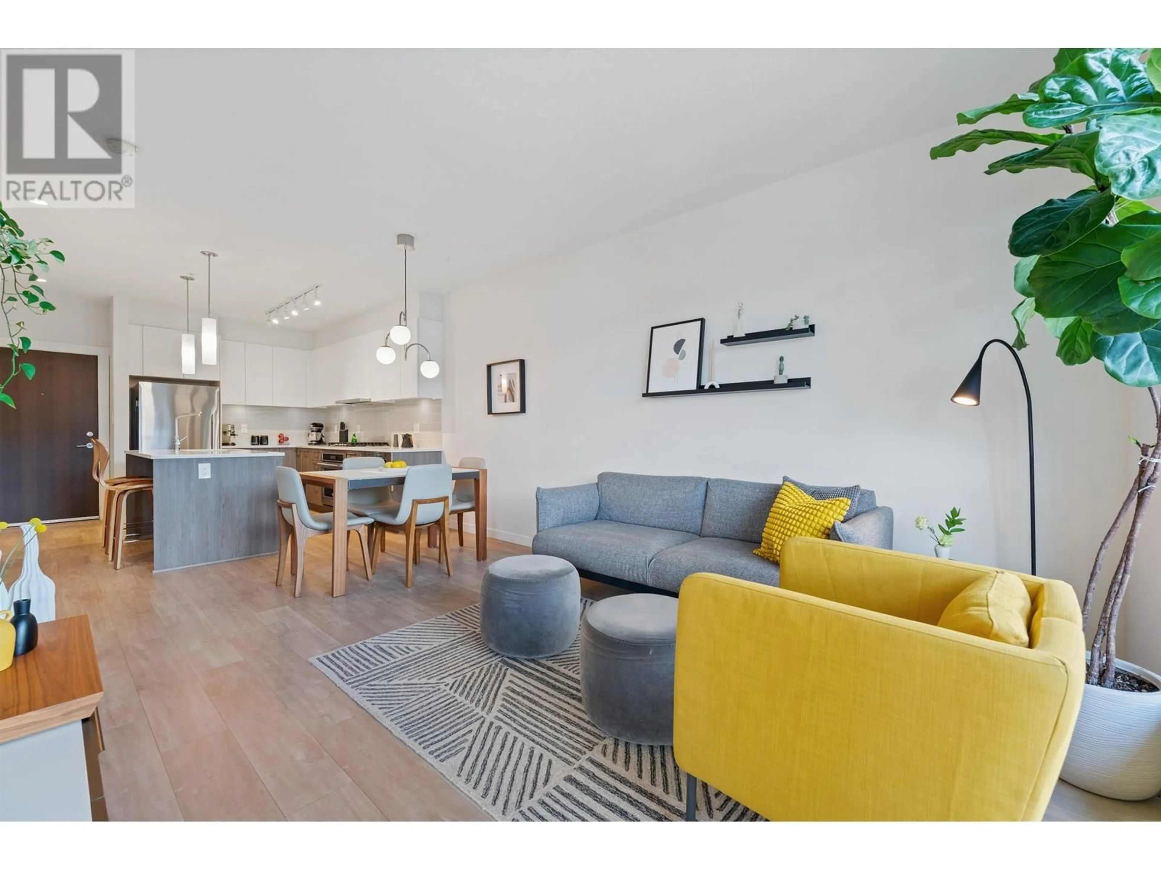 Living room with furniture, wood/laminate floor for 307 - 625 3RD STREET, North Vancouver British Columbia V7L1G6