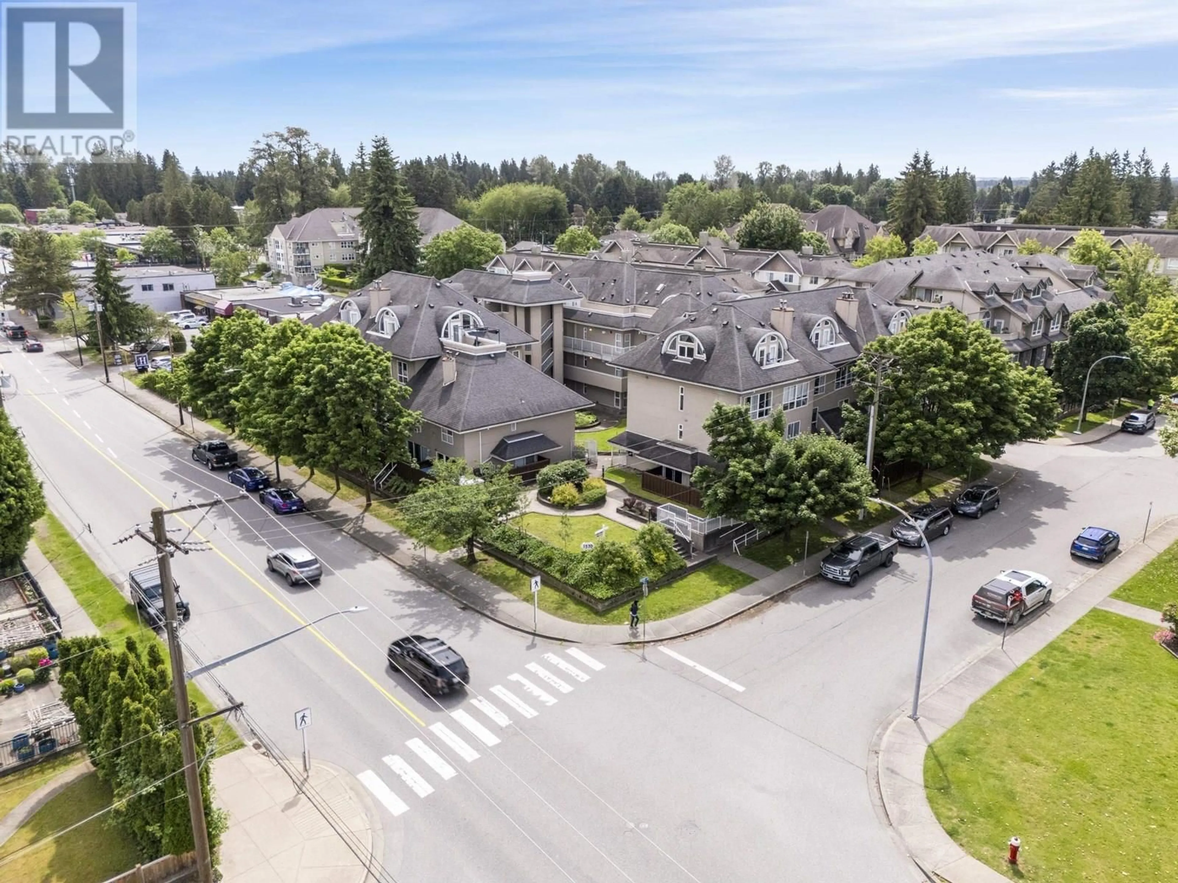 A pic from outside/outdoor area/front of a property/back of a property/a pic from drone, street for 404 - 1570 PRAIRIE AVENUE, Port Coquitlam British Columbia V3B1T4