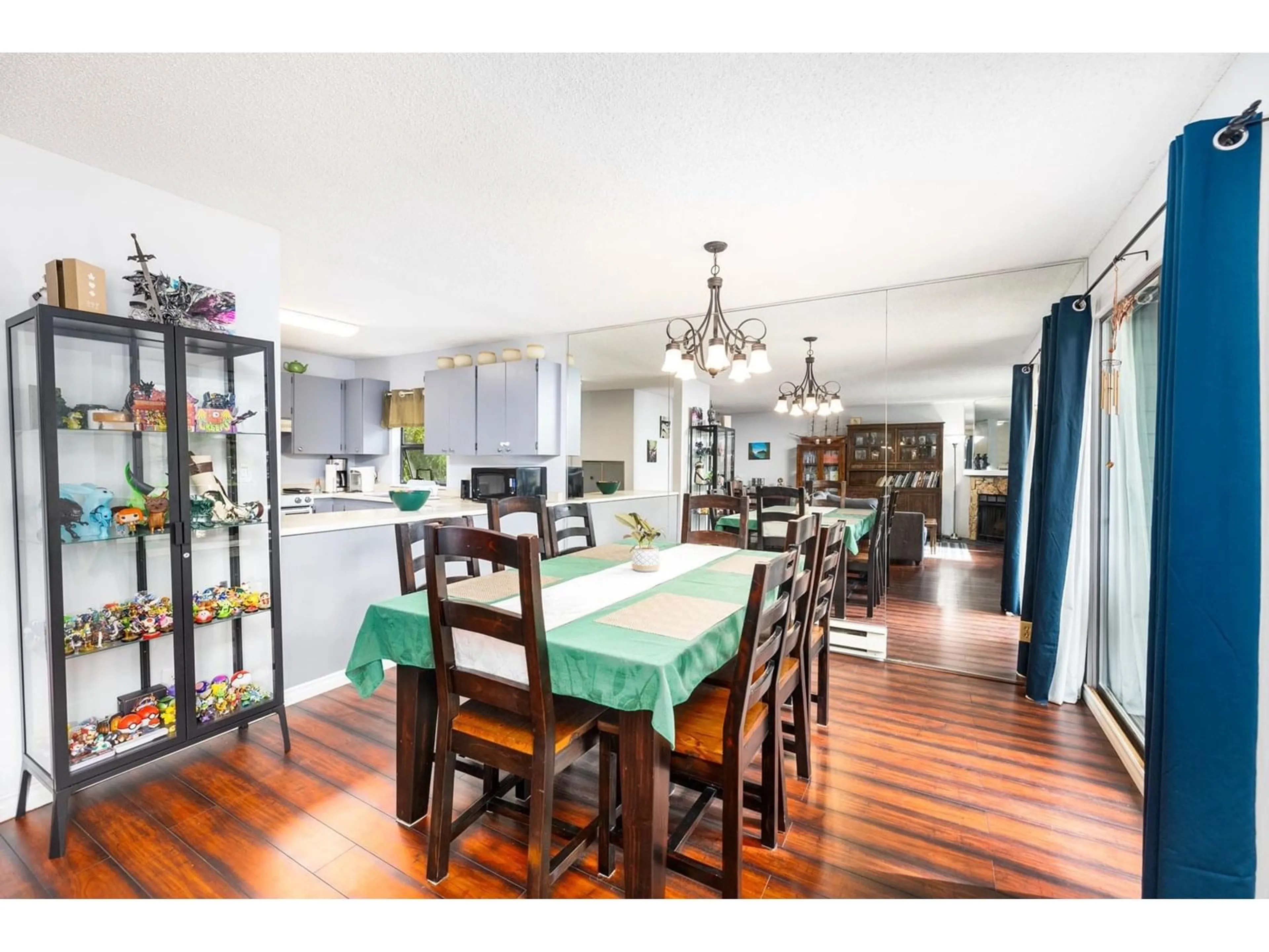 Dining room, wood/laminate floor for 201 - 7064 133B, Surrey British Columbia V3W8A4