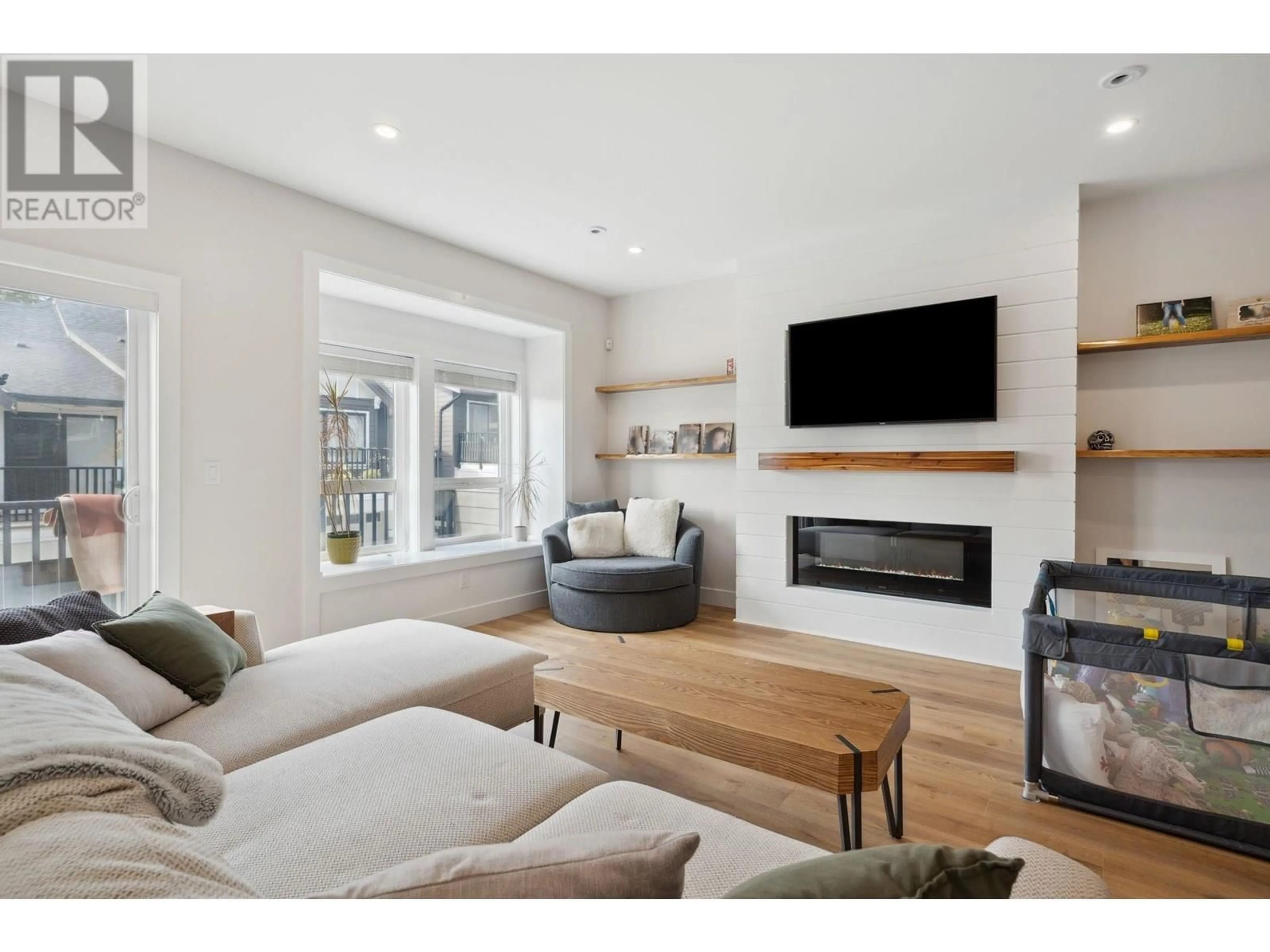 Living room with furniture, wood/laminate floor for 117 - 3409 HARPER ROAD, Coquitlam British Columbia V3E3H1