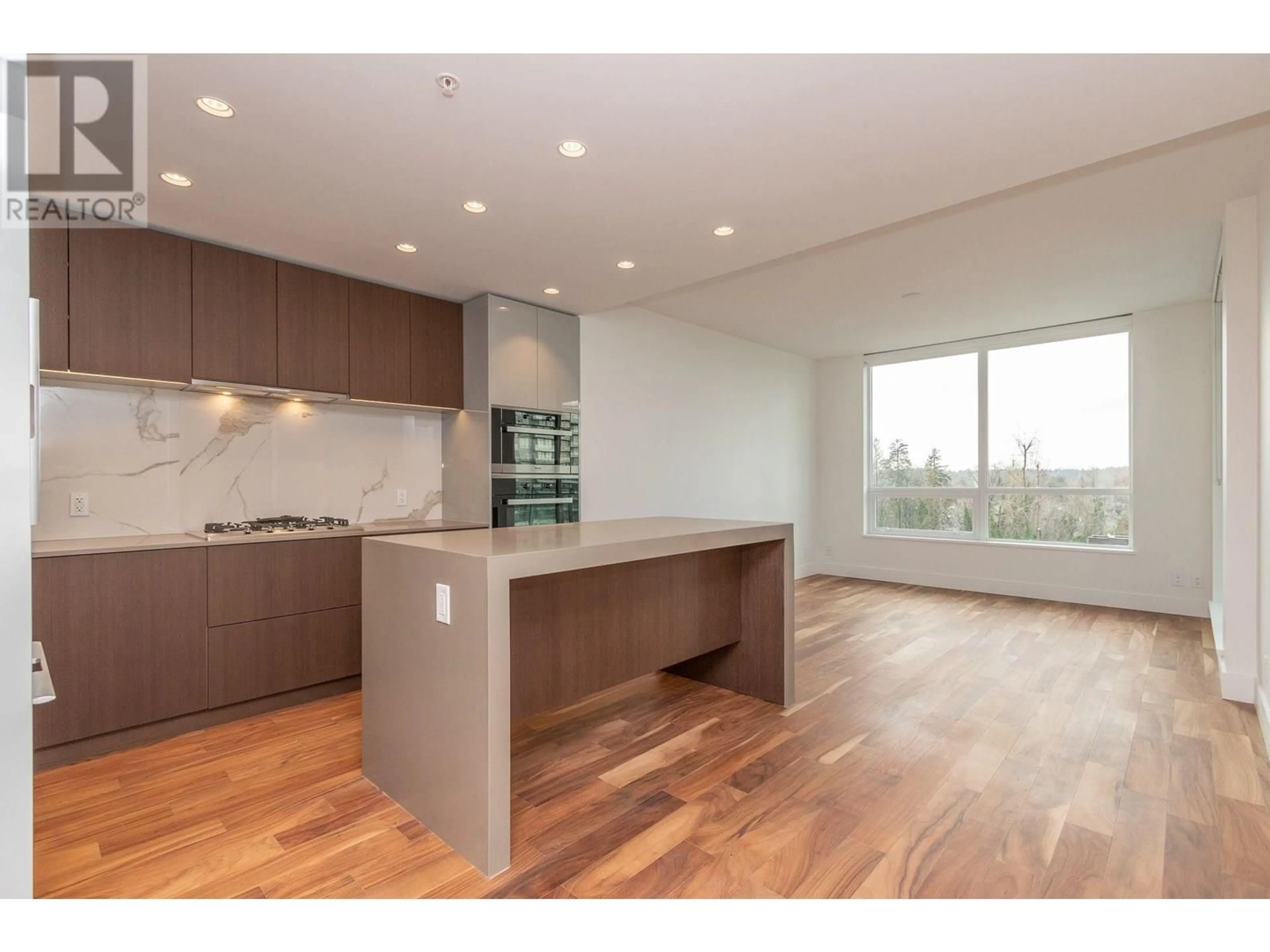 Open concept kitchen, wood/laminate floor for 605 - 1675 LIONS GATE LANE, North Vancouver British Columbia V7P3B4