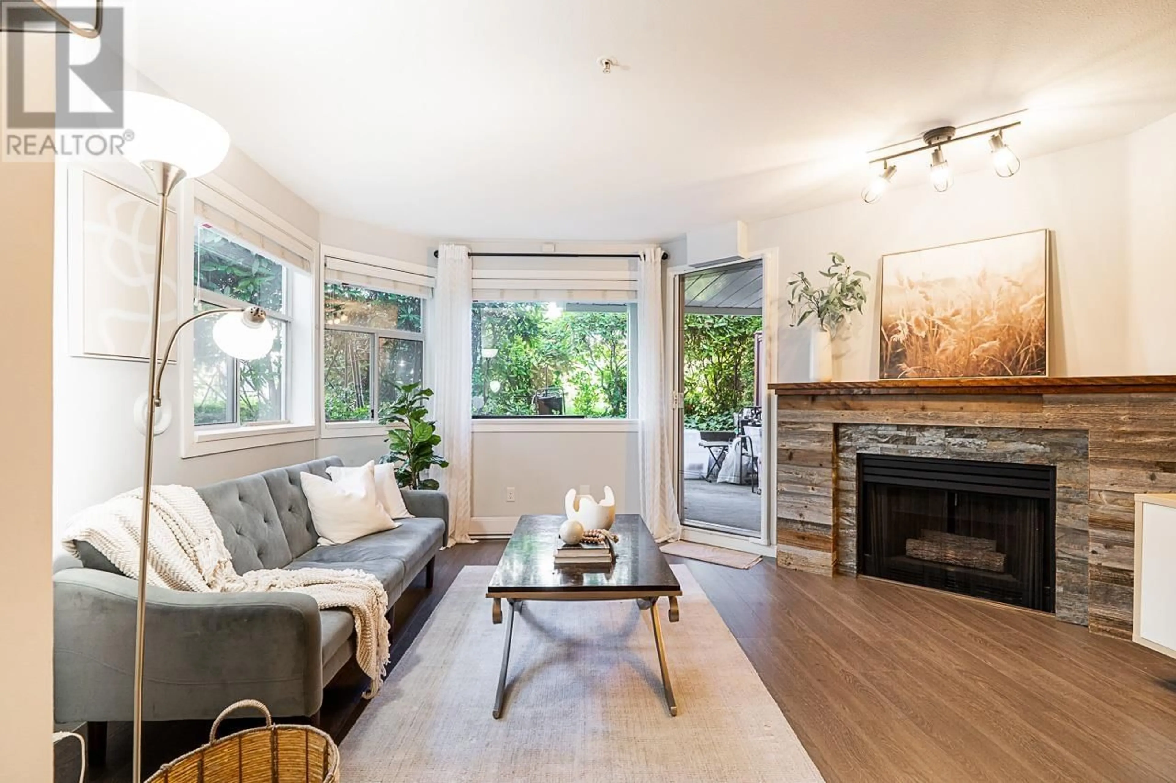 Living room with furniture, wood/laminate floor for 106 - 3628 RAE AVENUE, Vancouver British Columbia V5R2P5