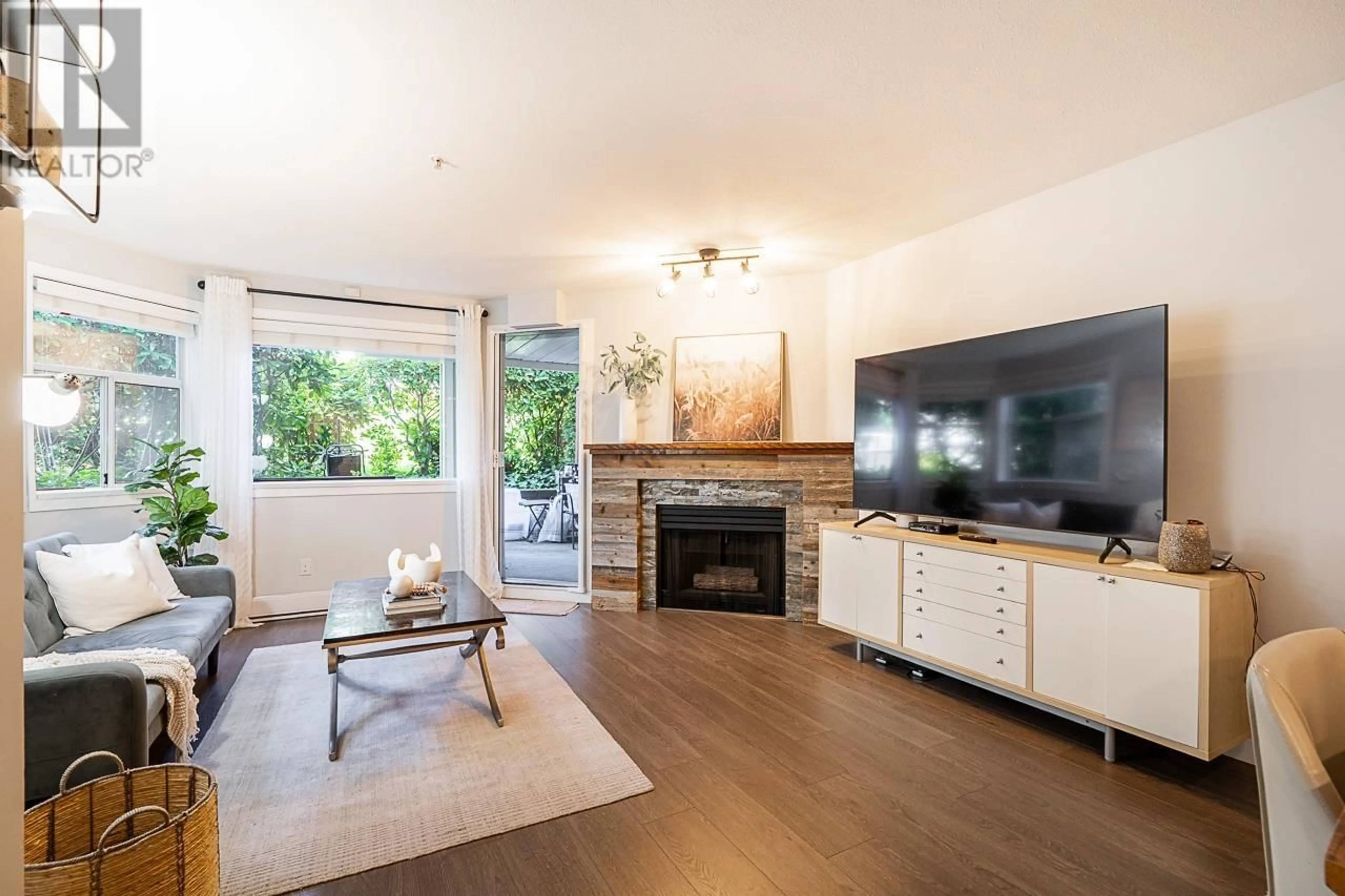 Living room with furniture, wood/laminate floor for 106 - 3628 RAE AVENUE, Vancouver British Columbia V5R2P5