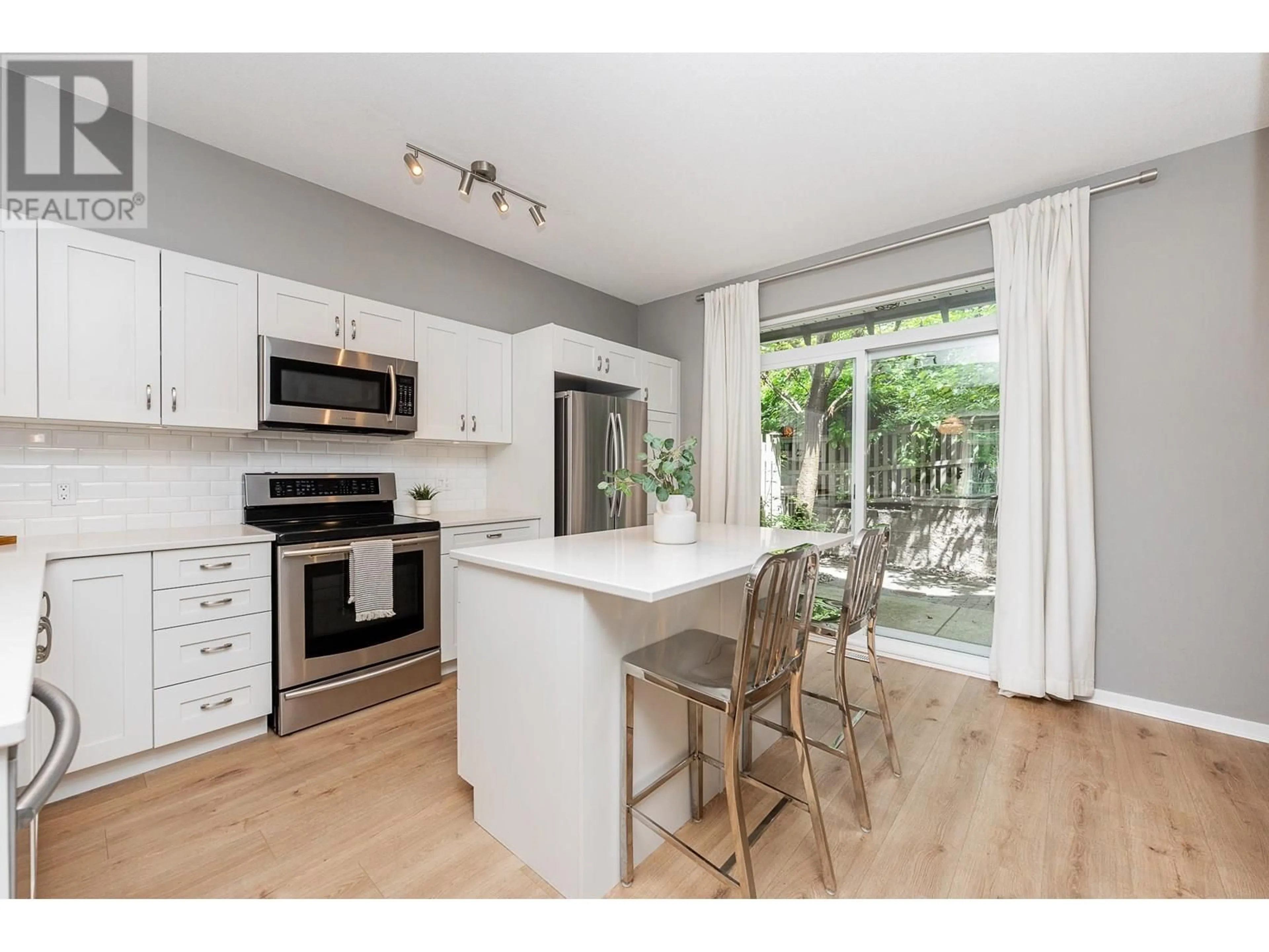 Open concept kitchen, wood/laminate floor for 75 - 2200 PANORAMA DRIVE, Port Moody British Columbia V3H5M2