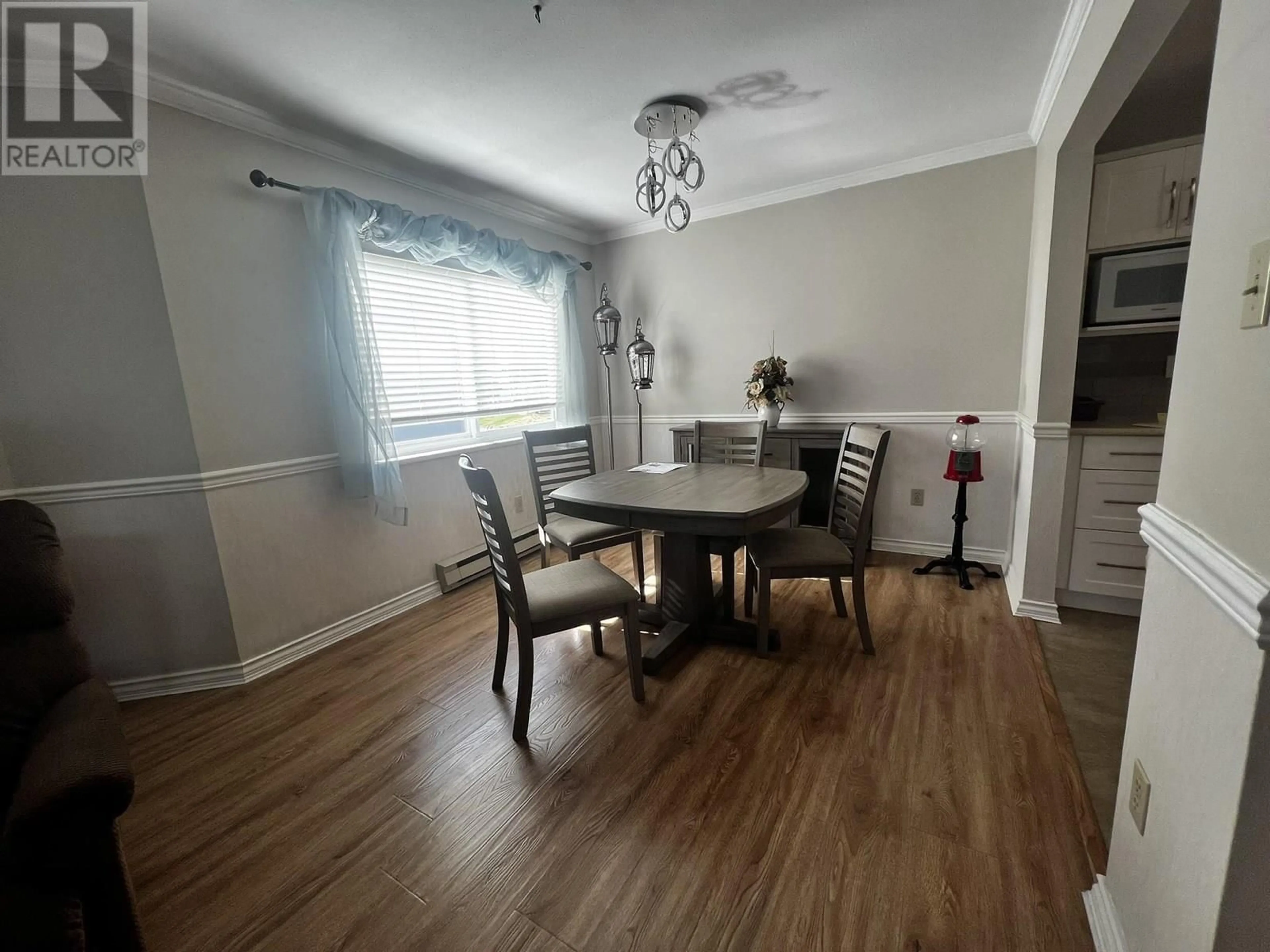 Dining room, wood/laminate floor for 101 - 22241 SELKIRK AVENUE, Maple Ridge British Columbia V2X2X4
