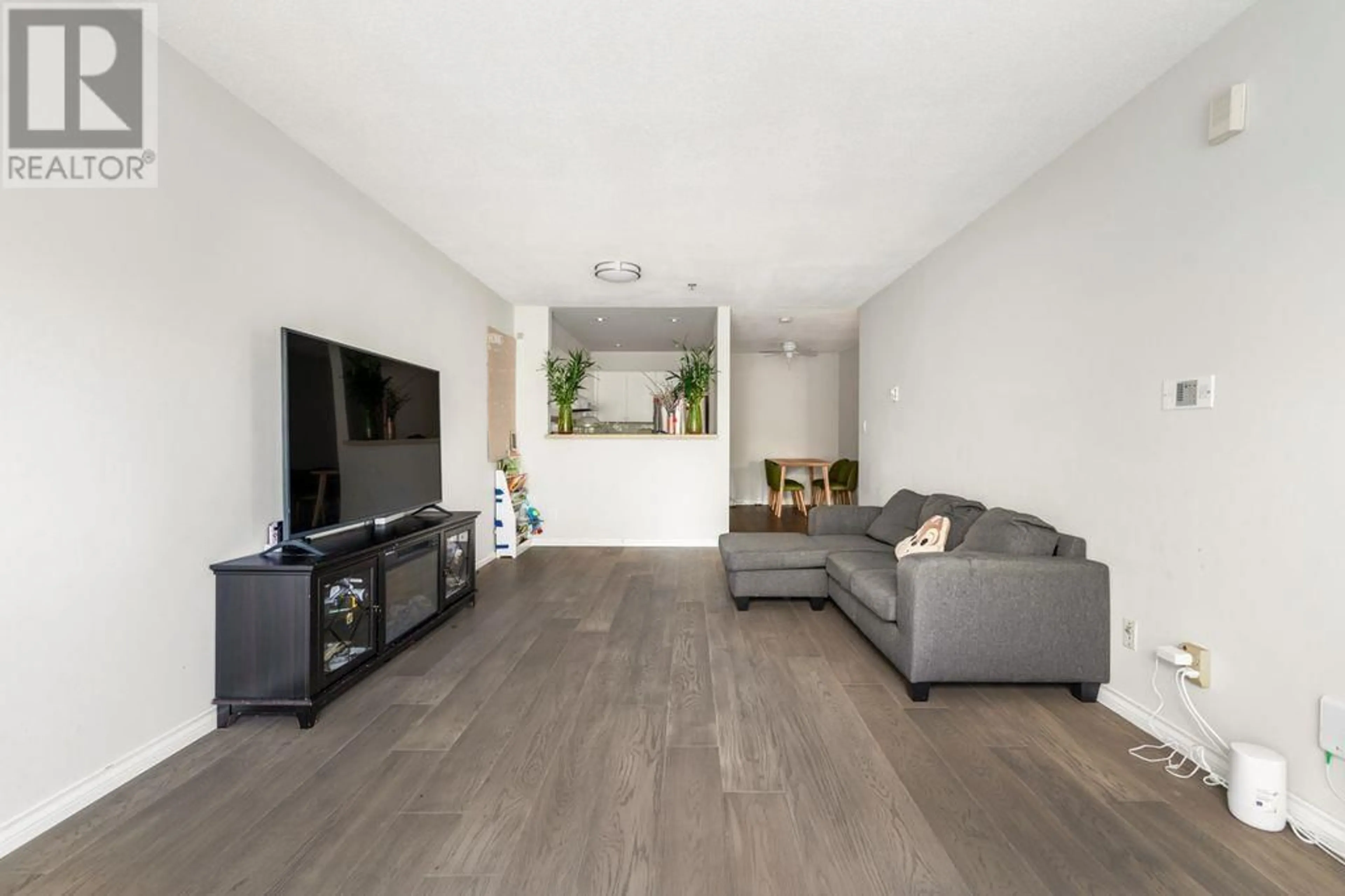Living room with furniture, wood/laminate floor for 107 - 8620 JONES ROAD, Richmond British Columbia V6Y3Z4