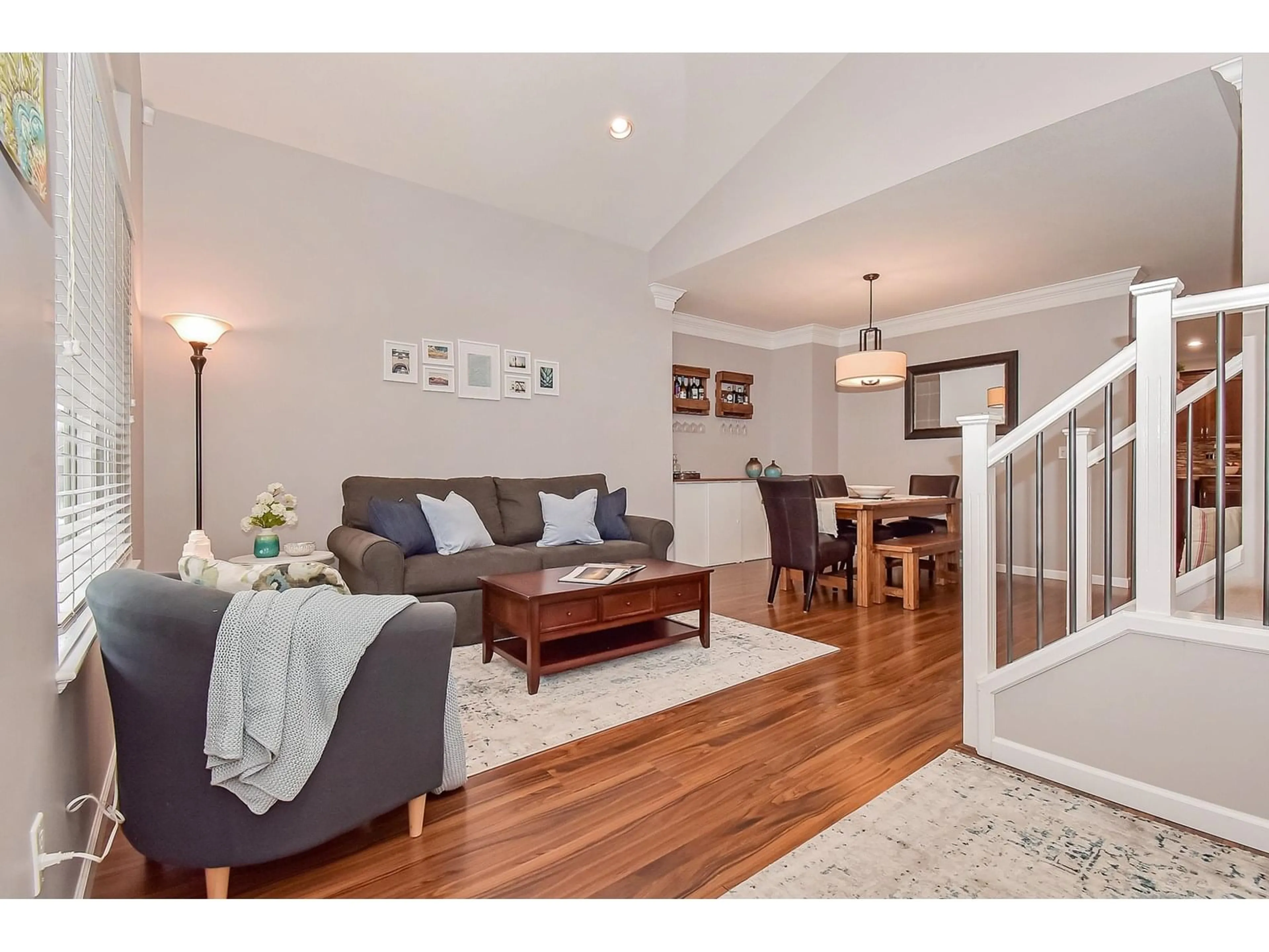 Living room with furniture, wood/laminate floor for 16594 59A, Surrey British Columbia V3S4N9