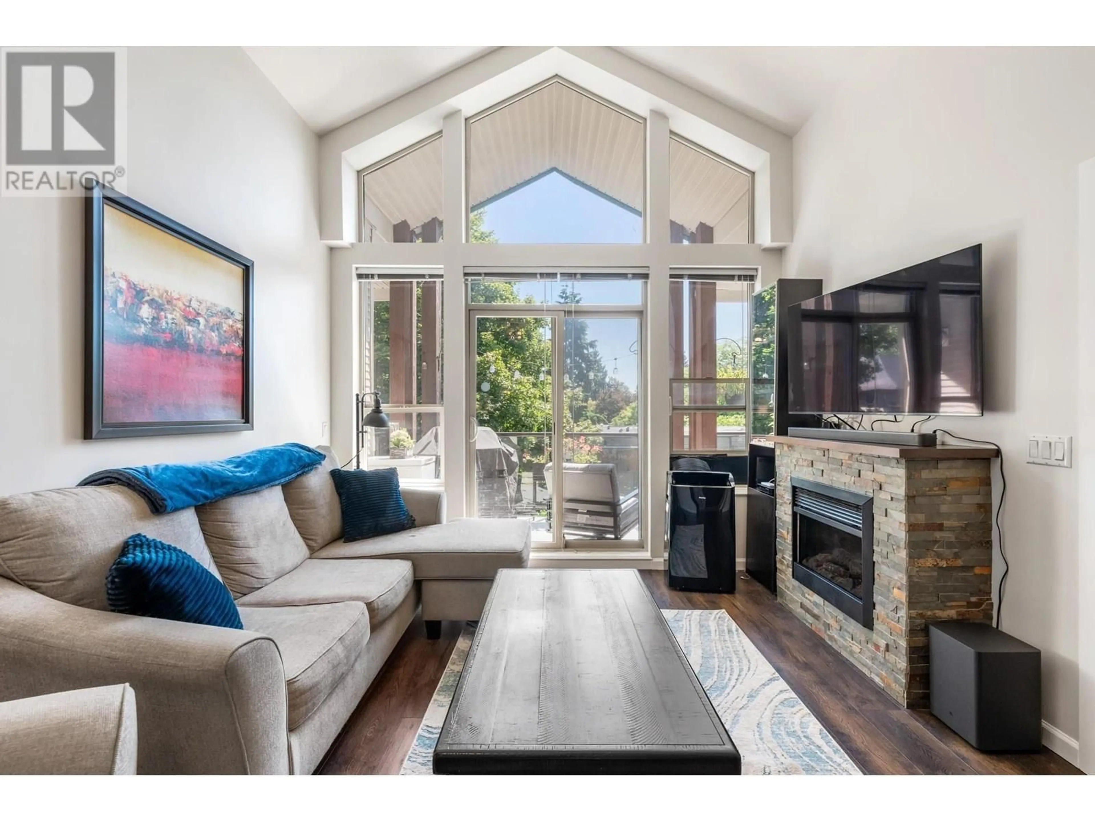 Living room with furniture, wood/laminate floor for 415 - 2484 WILSON AVENUE, Port Coquitlam British Columbia V3C0A5