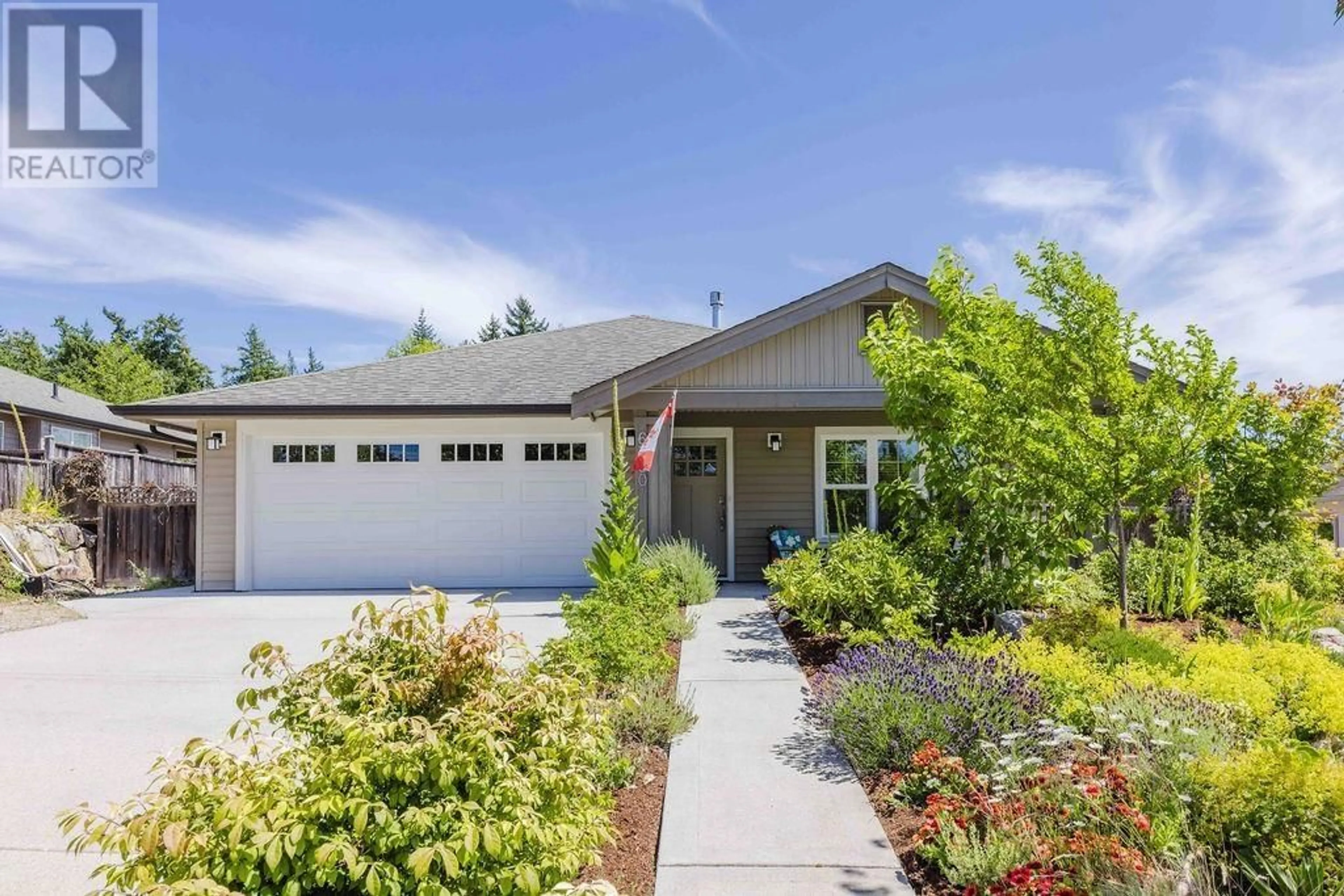Home with vinyl exterior material, street for 6360 BAILLIE ROAD, Sechelt British Columbia V7Z0V2