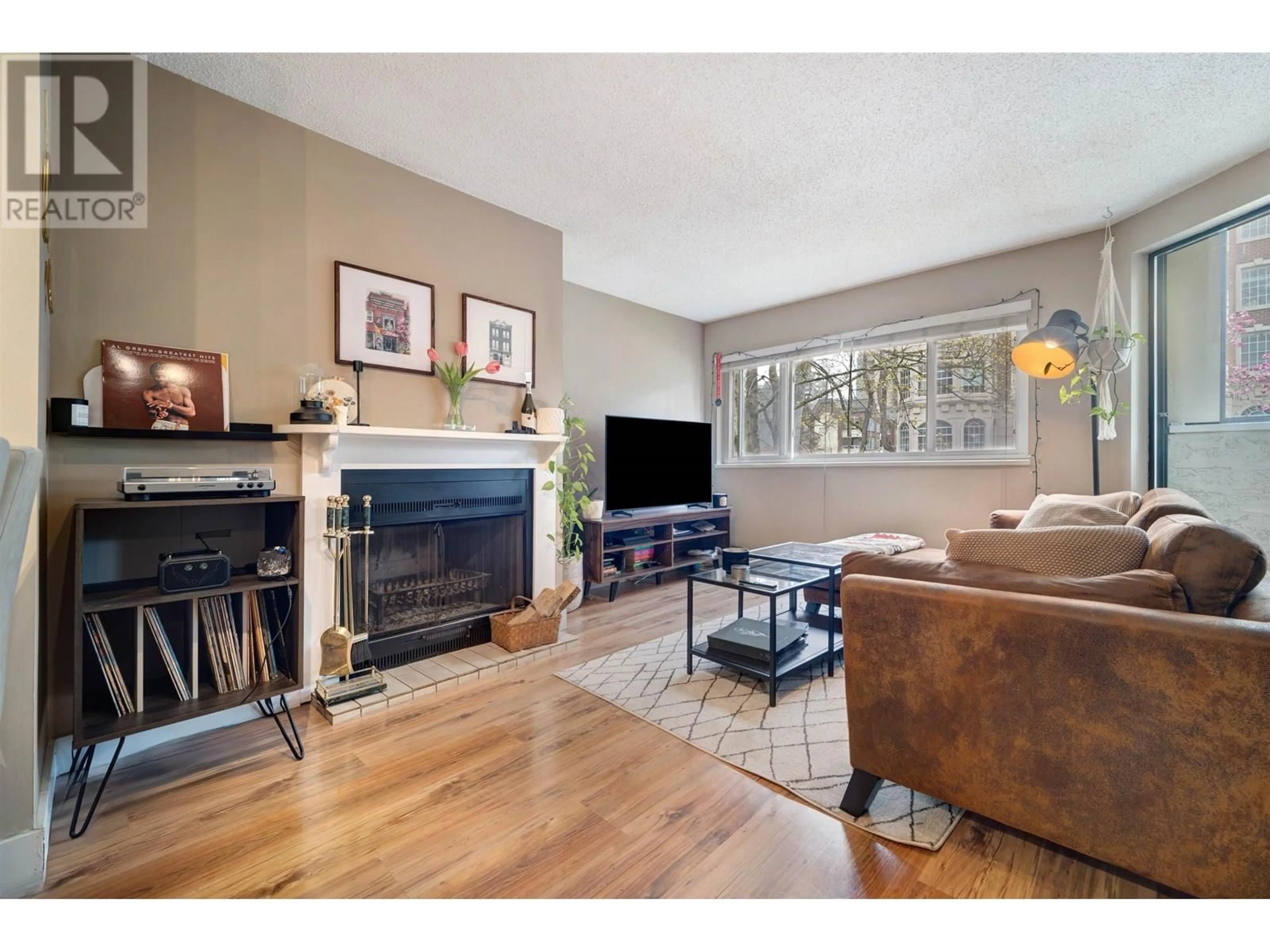 Living room with furniture, wood/laminate floor for 202 - 936 BUTE STREET, Vancouver British Columbia V6E1Y8