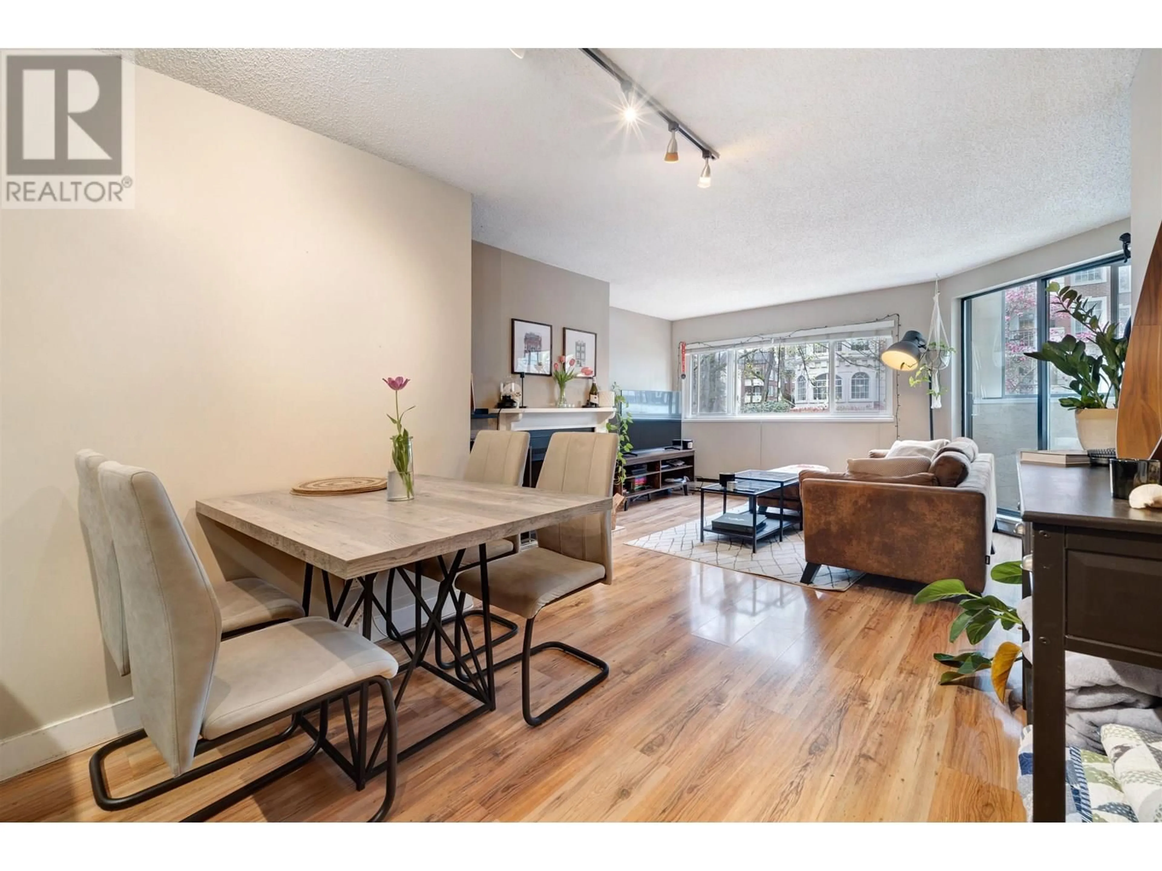 Living room with furniture, wood/laminate floor for 202 - 936 BUTE STREET, Vancouver British Columbia V6E1Y8
