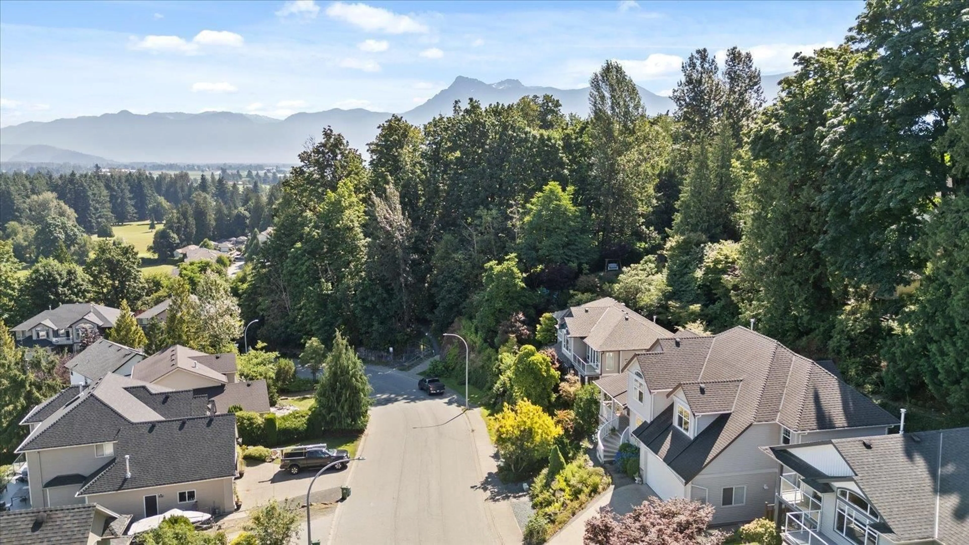 A pic from outside/outdoor area/front of a property/back of a property/a pic from drone, mountain view for 47416 CHARTWELL DRIVE, Chilliwack British Columbia V2P8B2
