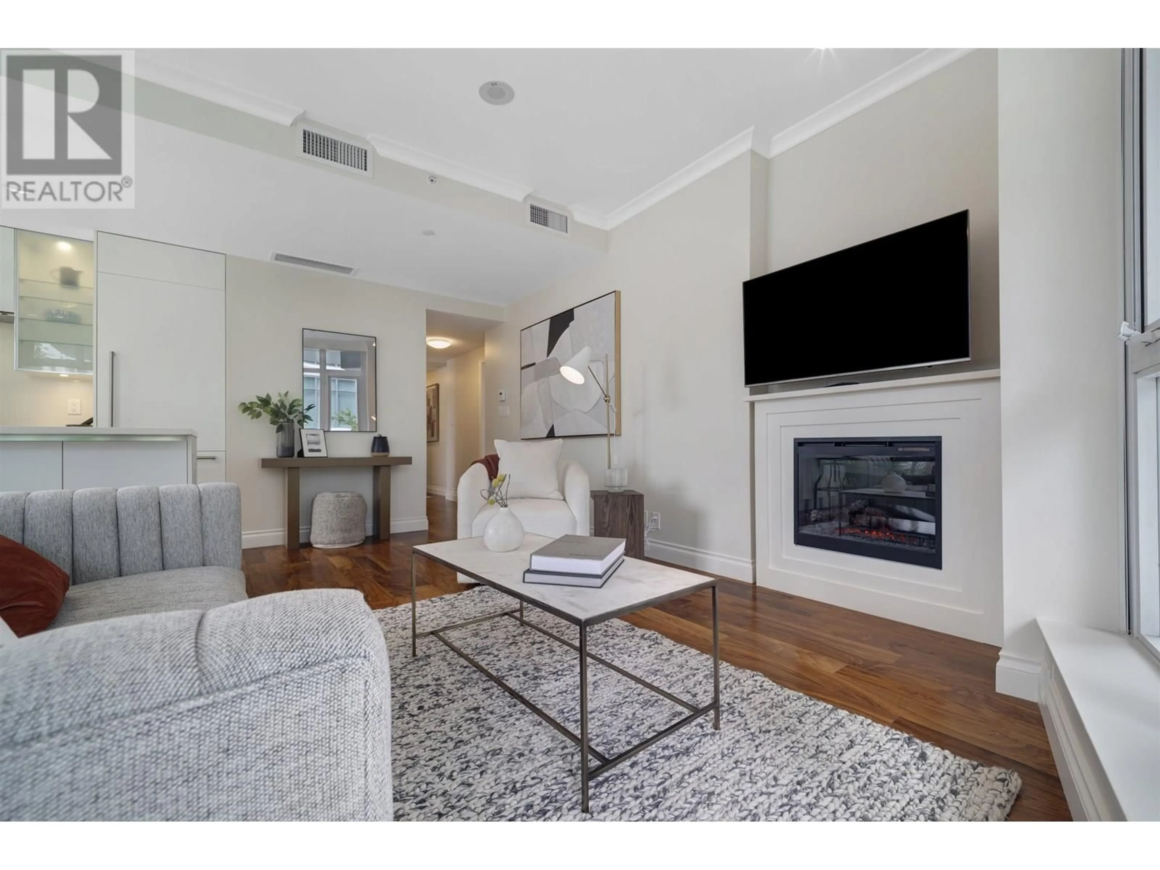 Living room with furniture, unknown for 209 - 199 VICTORY SHIP WAY, North Vancouver British Columbia V9L0E2