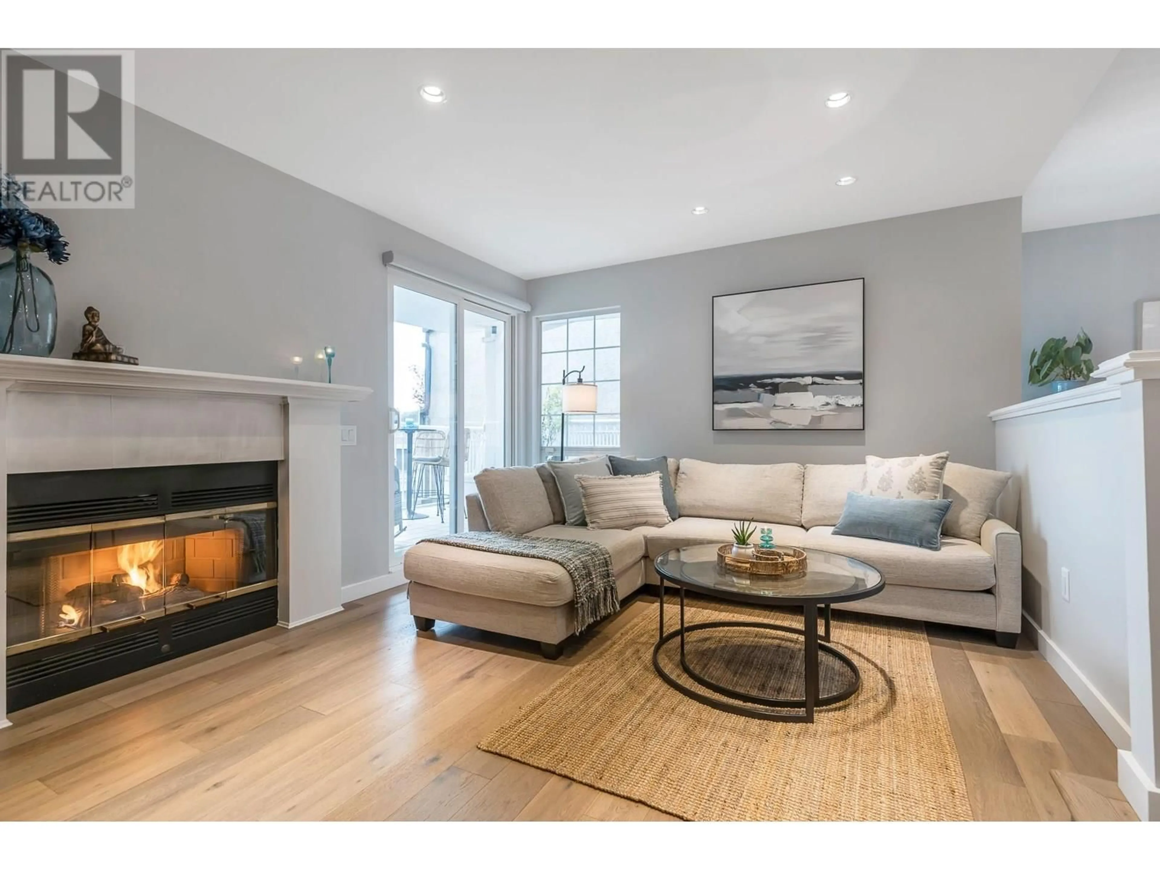 Living room with furniture, wood/laminate floor for 203 - 2440 HAYWOOD AVENUE, West Vancouver British Columbia V7V1Y1