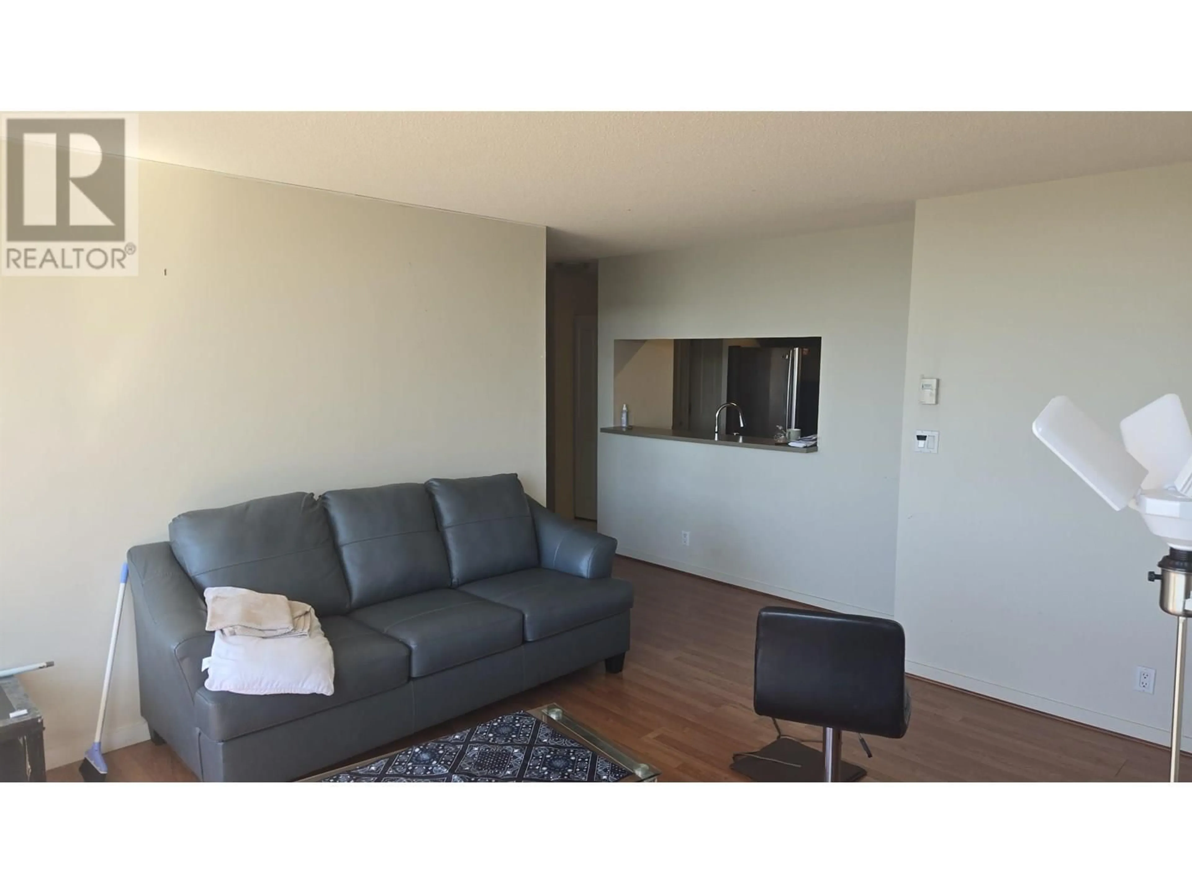 Living room with furniture, wood/laminate floor for 2005 - 3663 CROWLEY DRIVE, Vancouver British Columbia V5R6H4