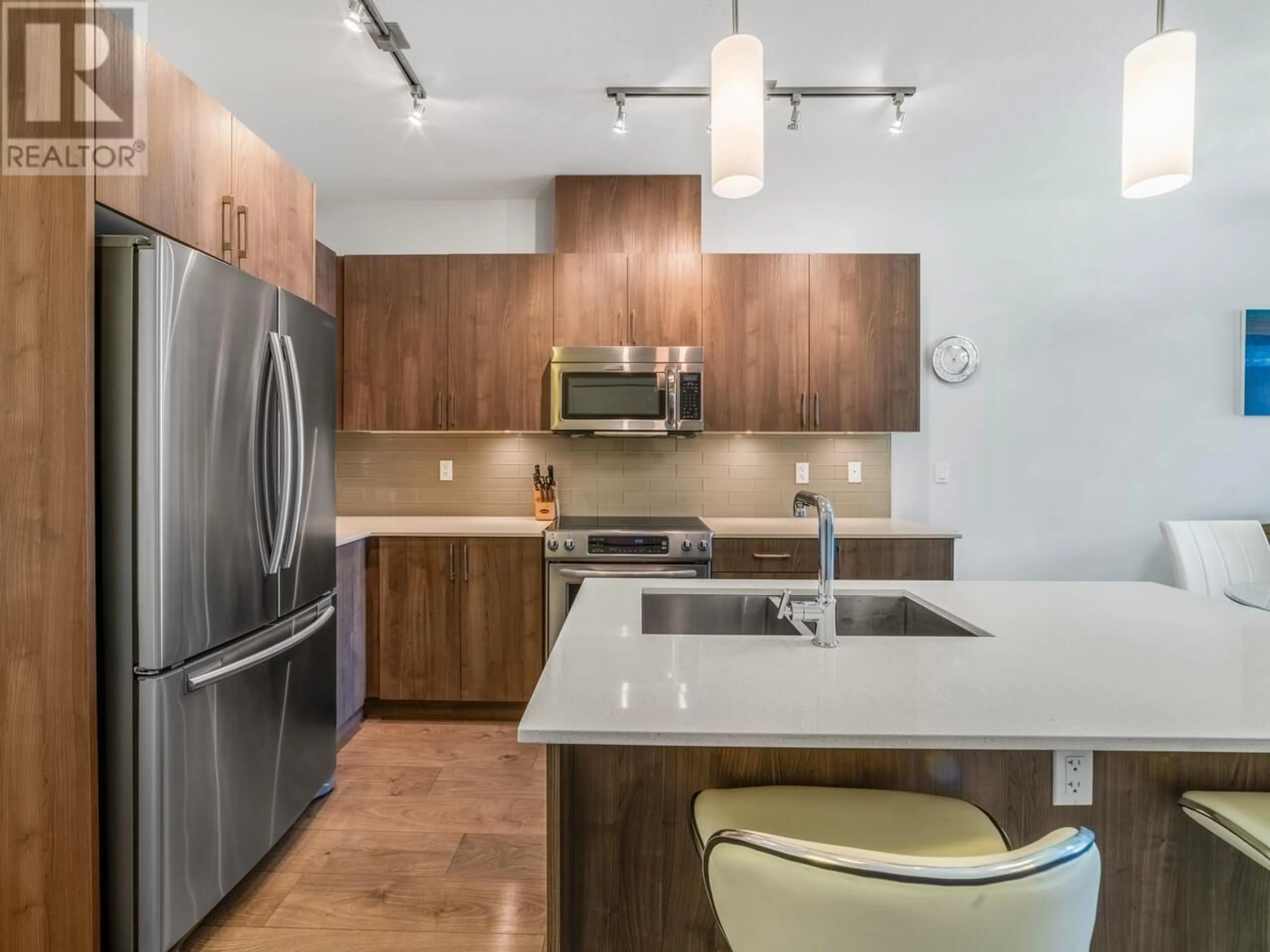 Open concept kitchen, wood/laminate floor for 408 - 630 COMO LAKE AVENUE, Coquitlam British Columbia V3J0E4