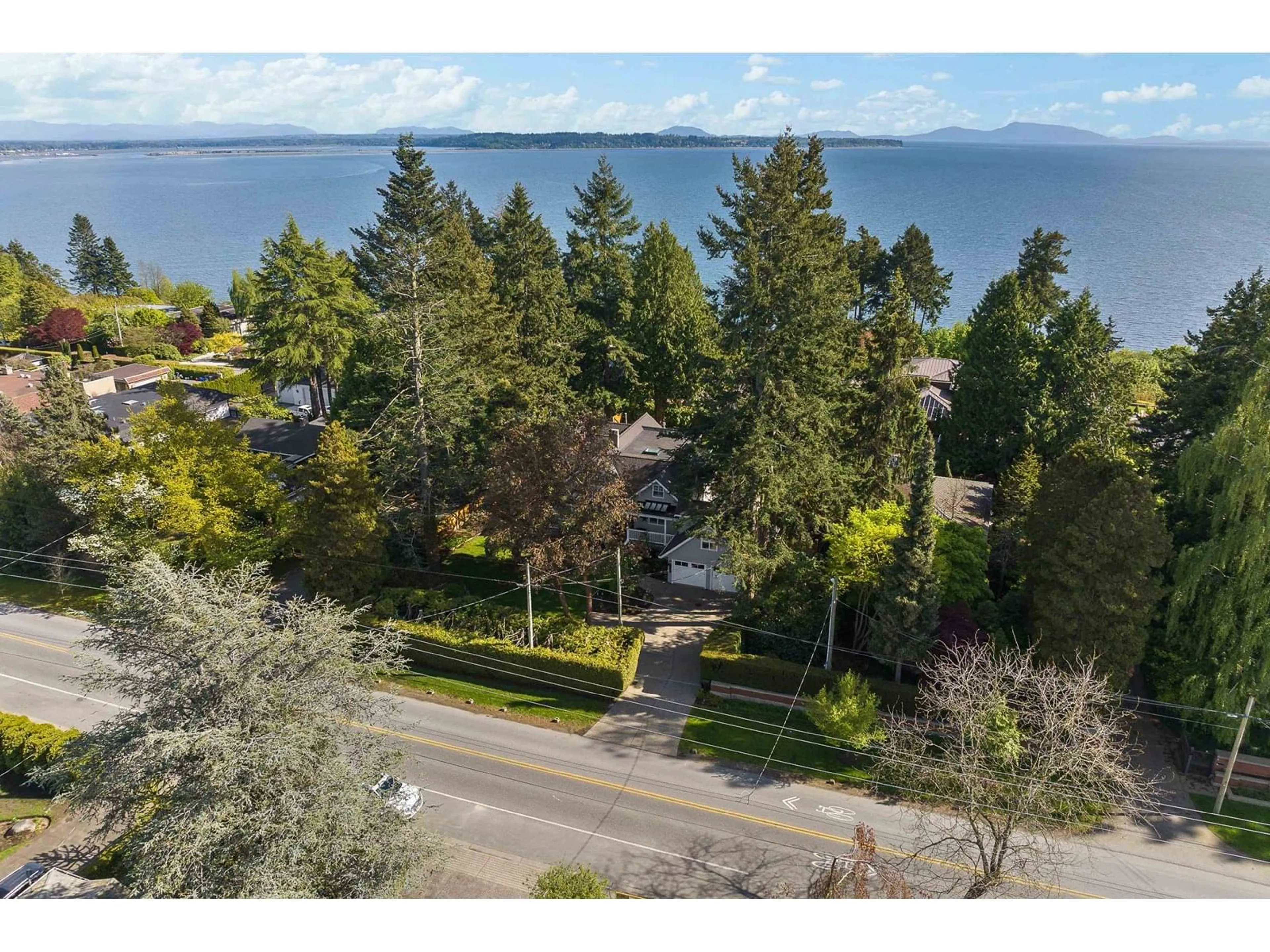 A pic from outside/outdoor area/front of a property/back of a property/a pic from drone, water/lake/river/ocean view for 13892 MARINE, White Rock British Columbia V4B1A4