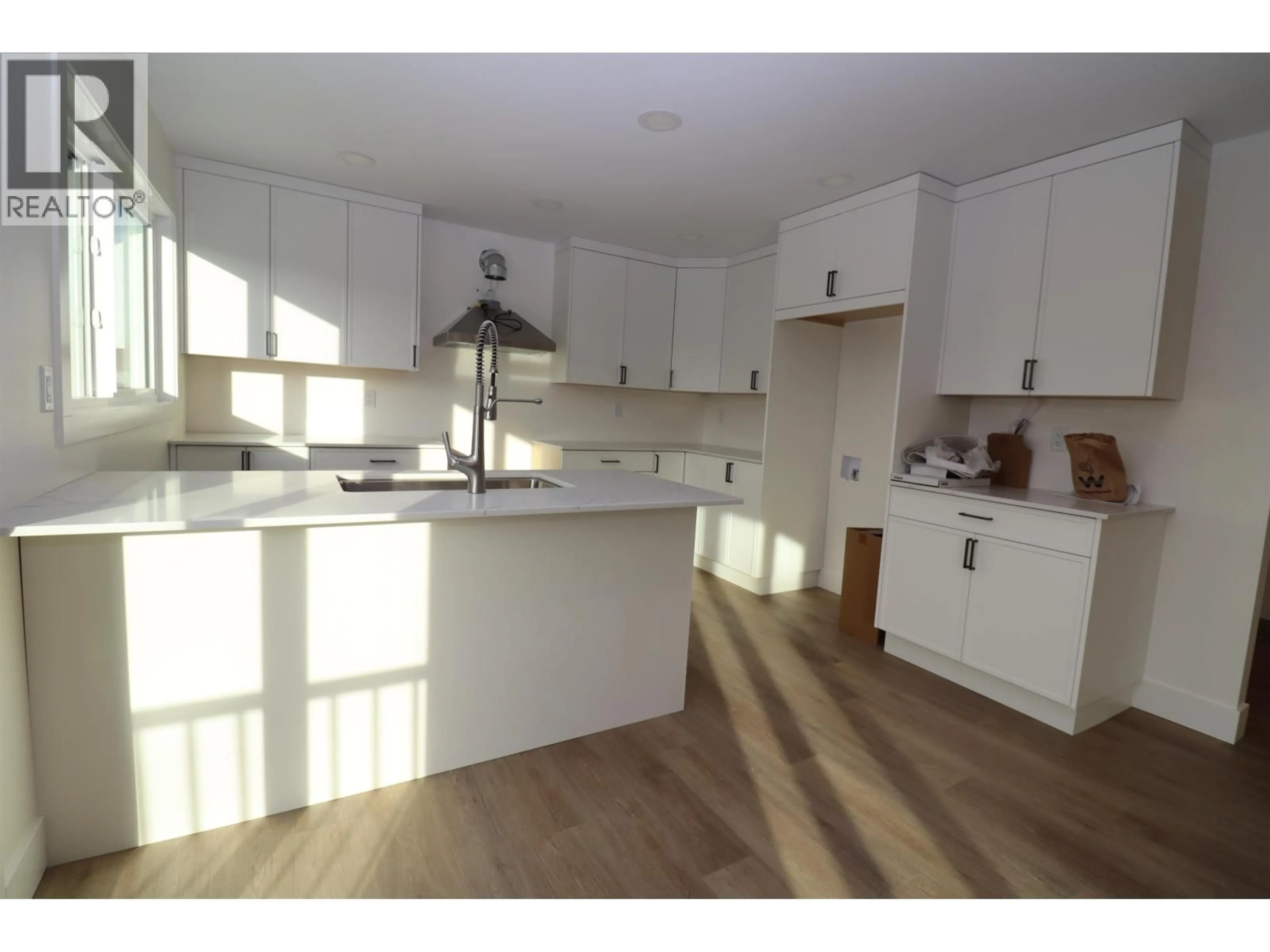 Open concept kitchen, wood/laminate floor for 2111 TAMARACK STREET, Prince George British Columbia V2L2T6