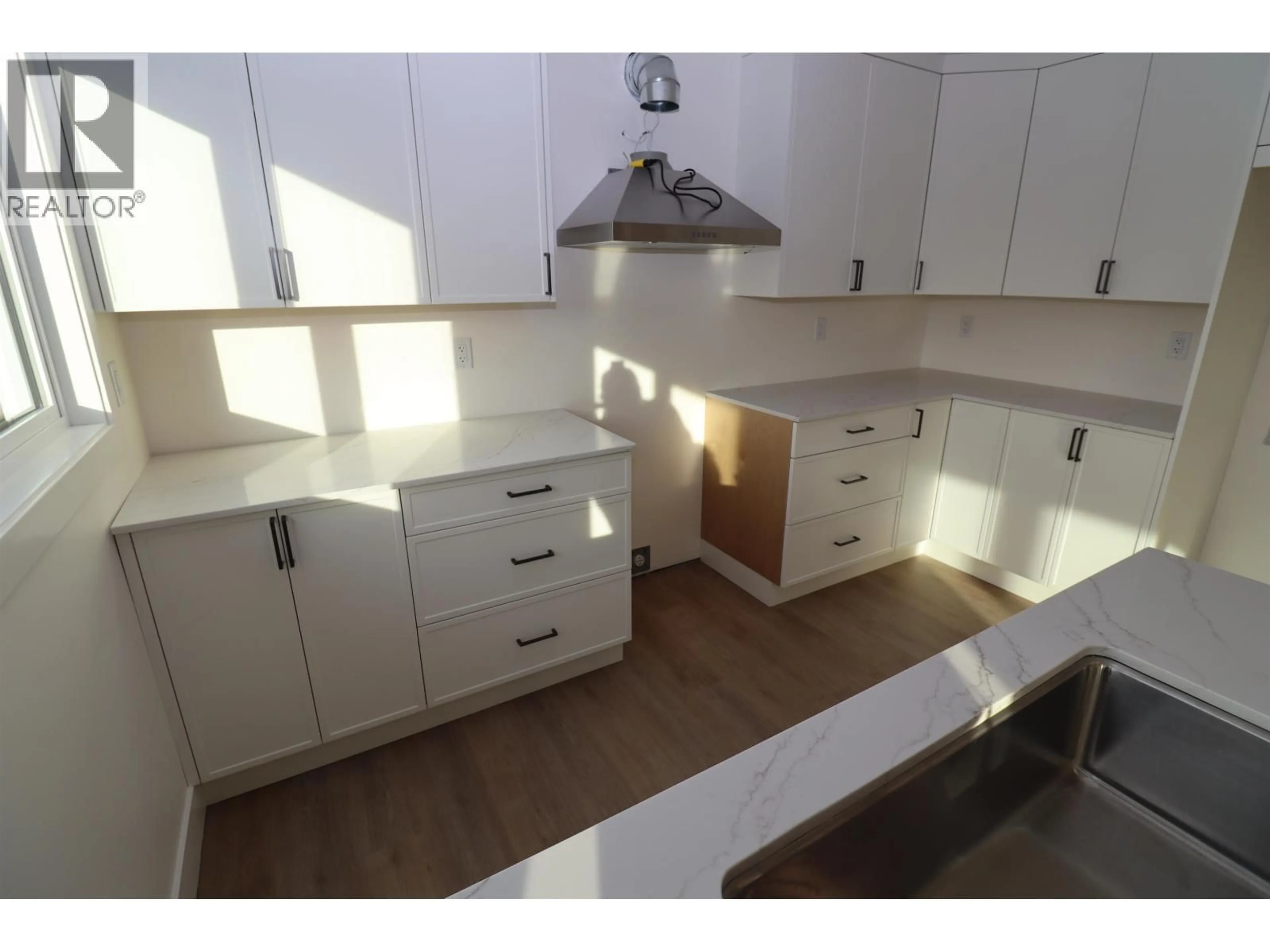 Open concept kitchen, wood/laminate floor for 2111 TAMARACK STREET, Prince George British Columbia V2L2T6